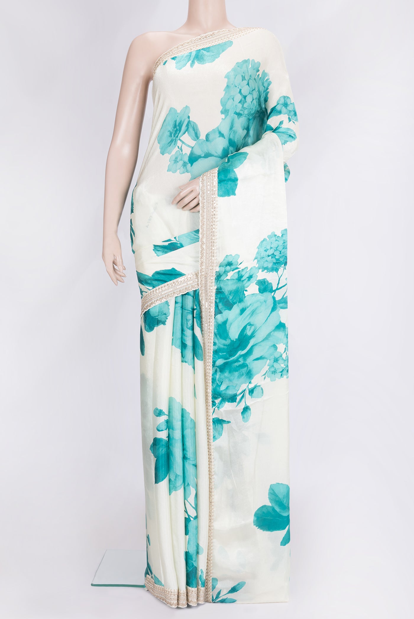 Off White Dual Tone Mysore Crepe Saree with Printed design on the body and Embroidery Border.  displayed on a mannequin