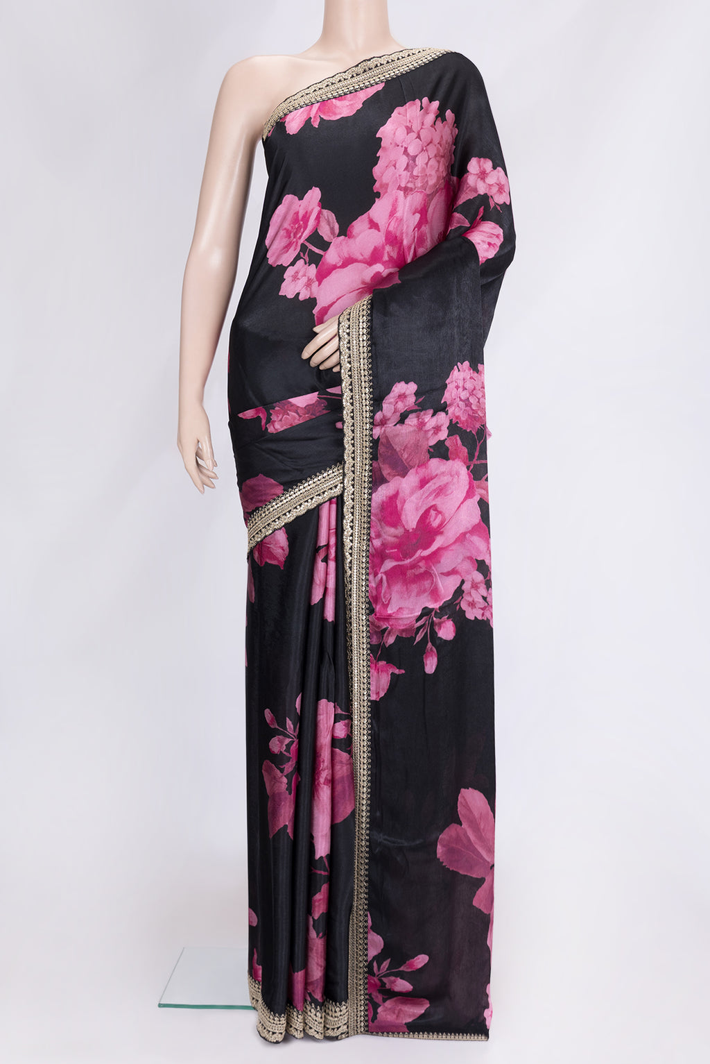Black Dual Tone Mysore Crepe Saree with Printed design on the body and Embroidery Border.  displayed on a mannequin