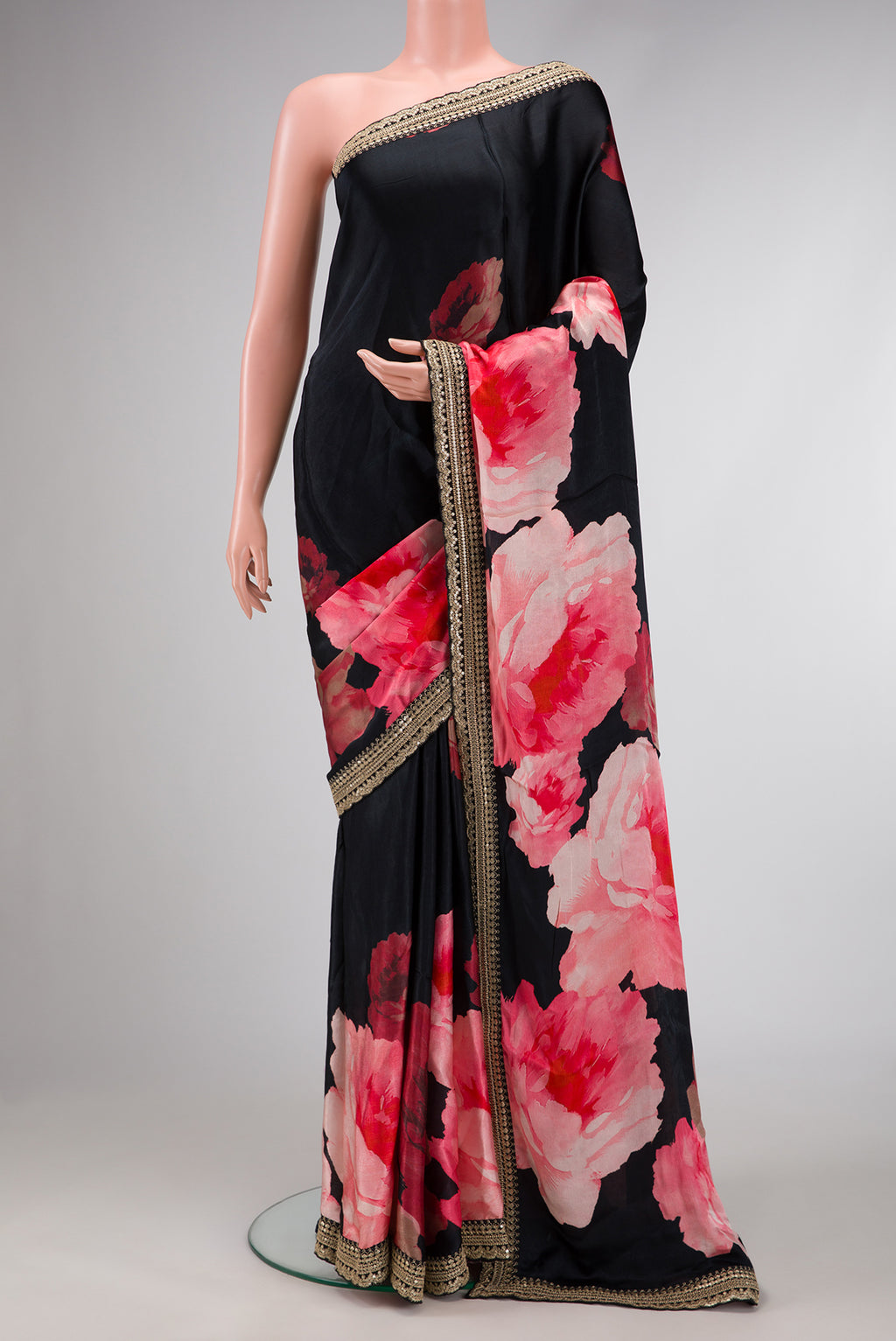 Black Dual Tone Organza Silk Saree with Printed design on the body and Embroidery Border.  displayed on a mannequin