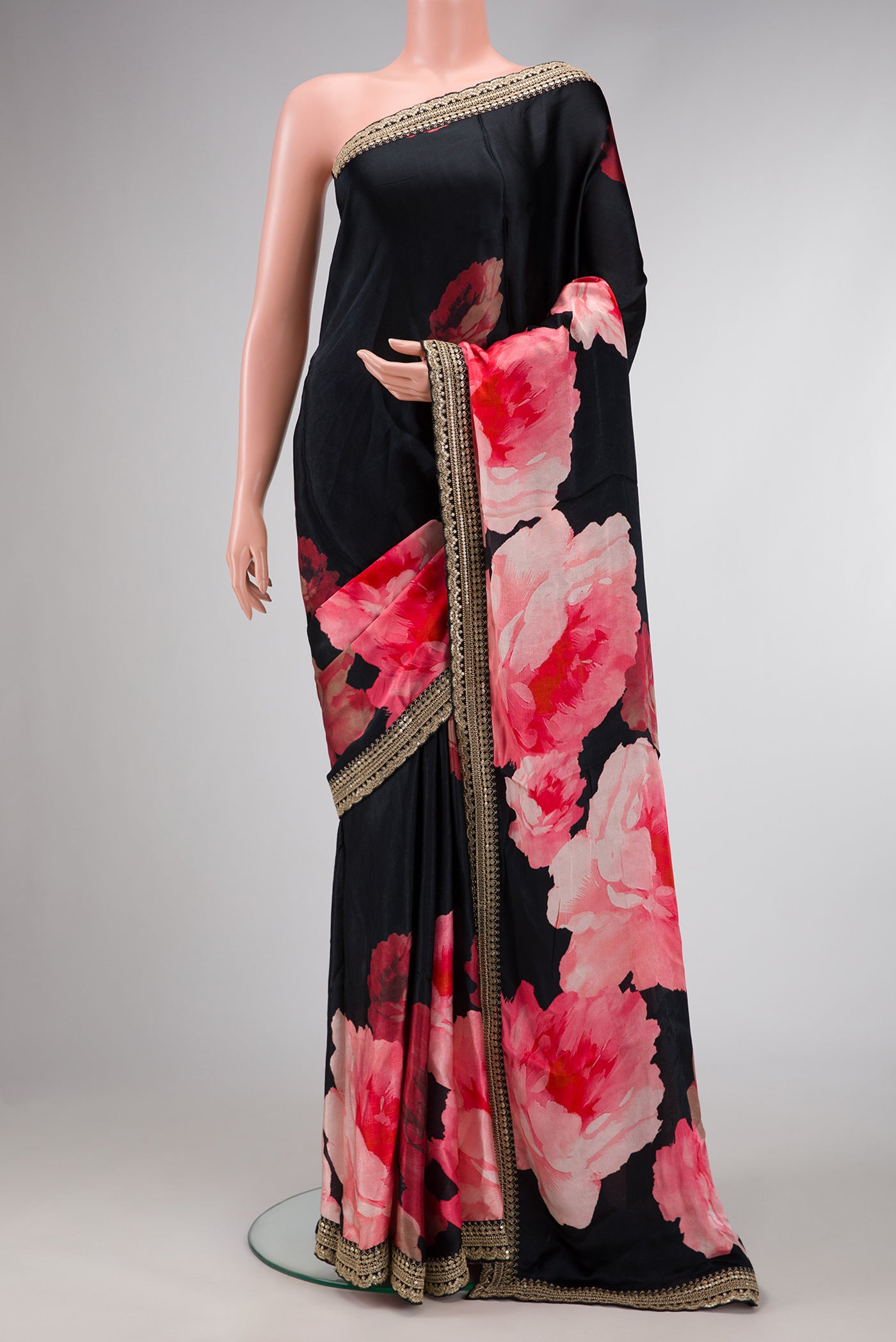 Black Dual Tone Organza Silk Saree with Printed design on the body and Embroidery Border.  displayed on a mannequin