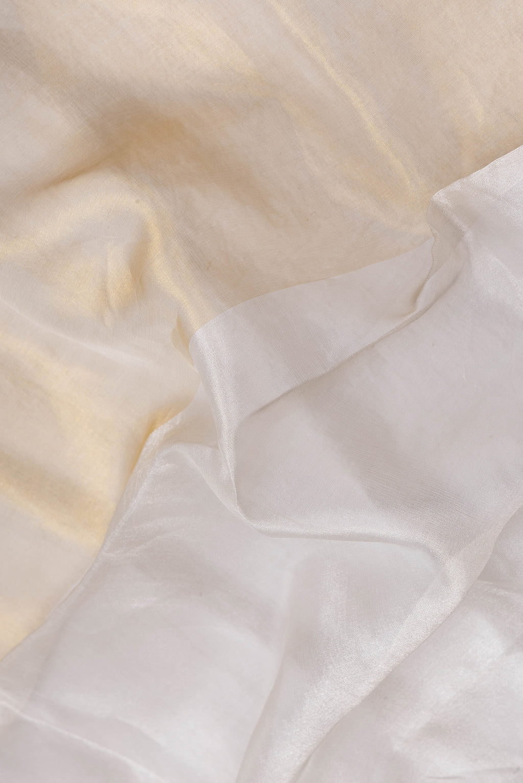 Close up of Mustard Dual Tone Mysore Crepe Saree with Printed design on the body and Embroidery Border.  displaying folds