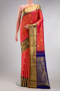 Pure Silk Pure Zari Coral Dual Tone Kanjivaram Saree with Zari Butta on the body and Zari Border.  displayed on a mannequin