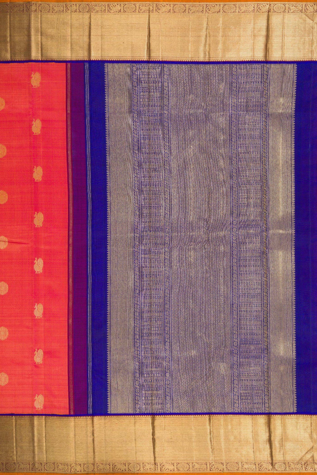 Close up image of the pallu of Pure Silk Pure Zari Coral Dual Tone Kanjivaram Saree with Zari Butta on the body and Zari Border. 
