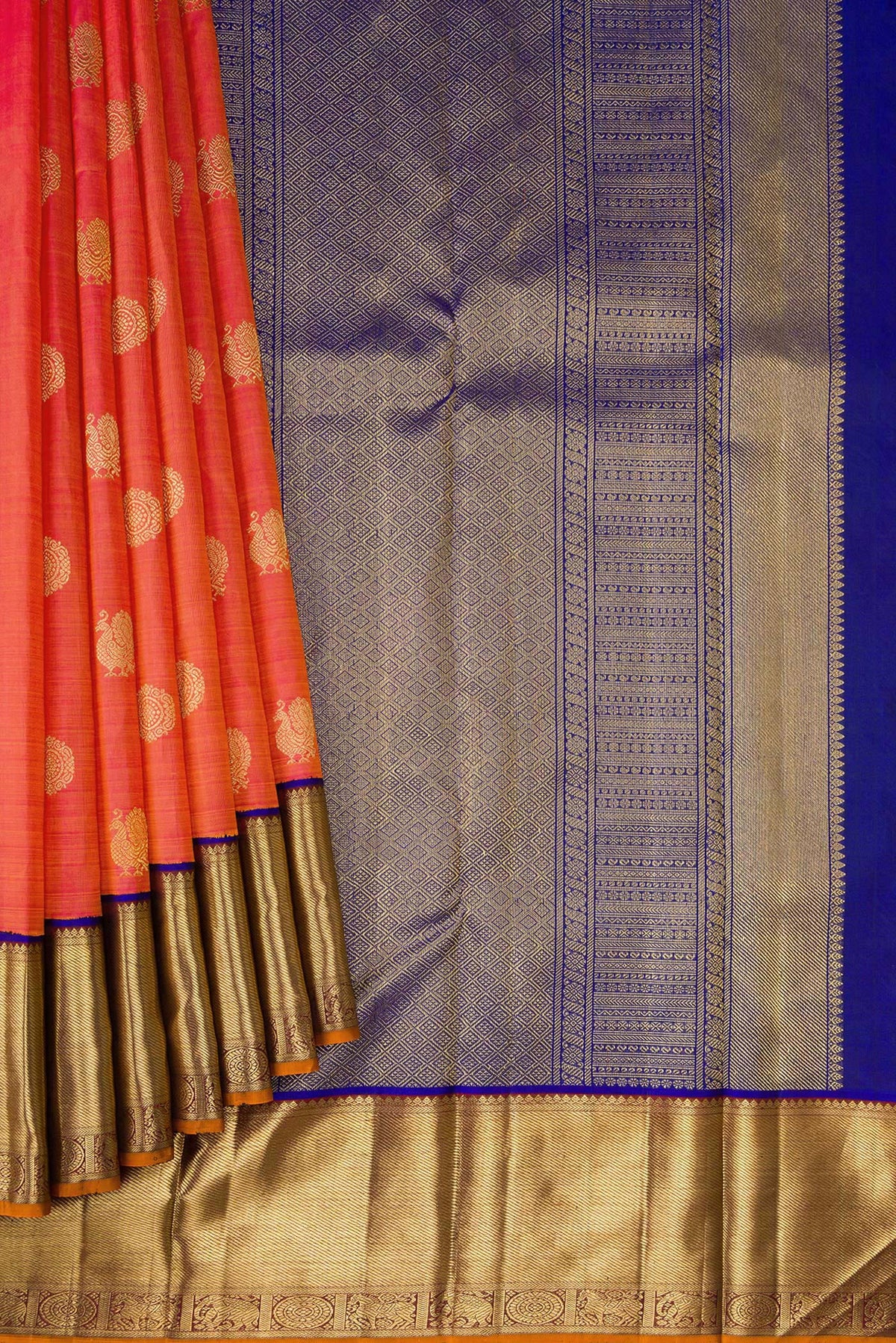 Pleats and pallu of Pure Silk Pure Zari Coral Dual Tone Kanjivaram Saree with Zari Butta on the body and Zari Border. 