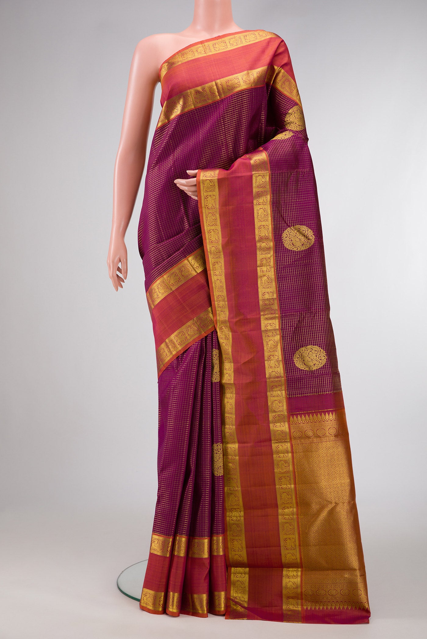 Purple Dual Tone Kanjivaram Silk Saree with Checked design on the body and Zari Border.  displayed on a mannequin