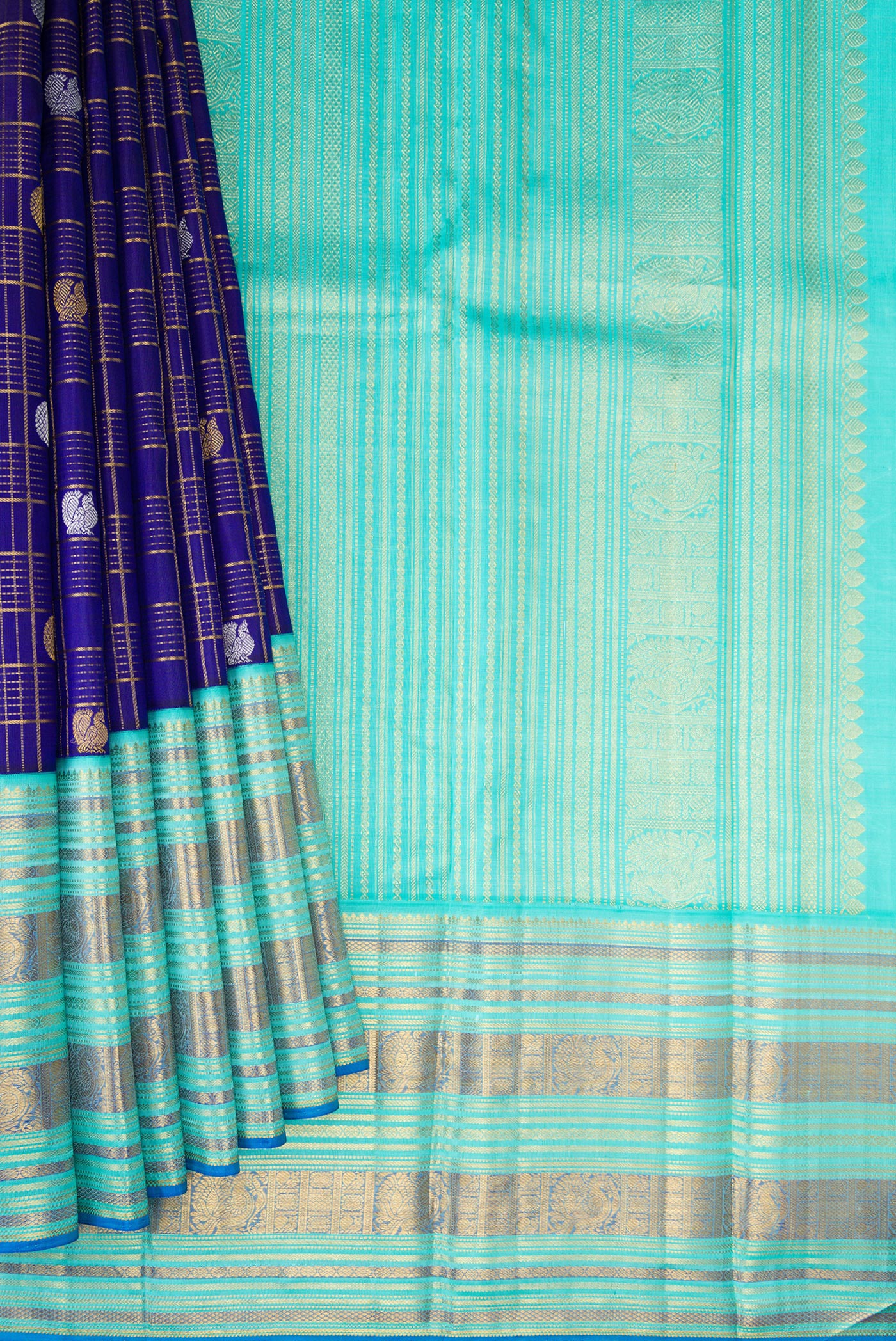 Pleats and pallu of Pure Silk Pure Zari Royal Blue Dual Tone Kanchipuram Saree with Checked design on the body and Zari Border. 