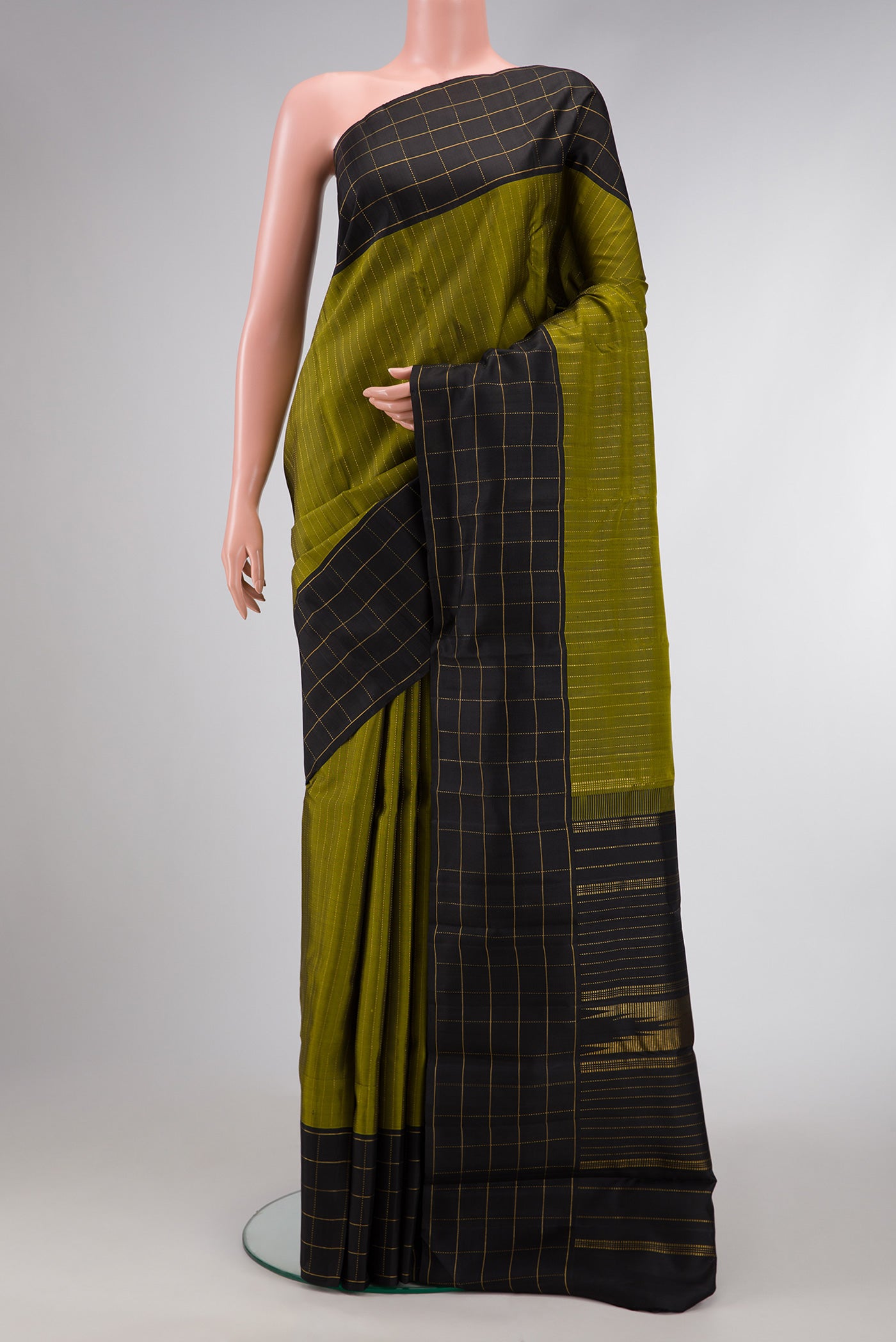 Mehandi Green Dual Tone Kanjivaram Silk Saree with Stripes on the body and Checks Border.  displayed on a mannequin