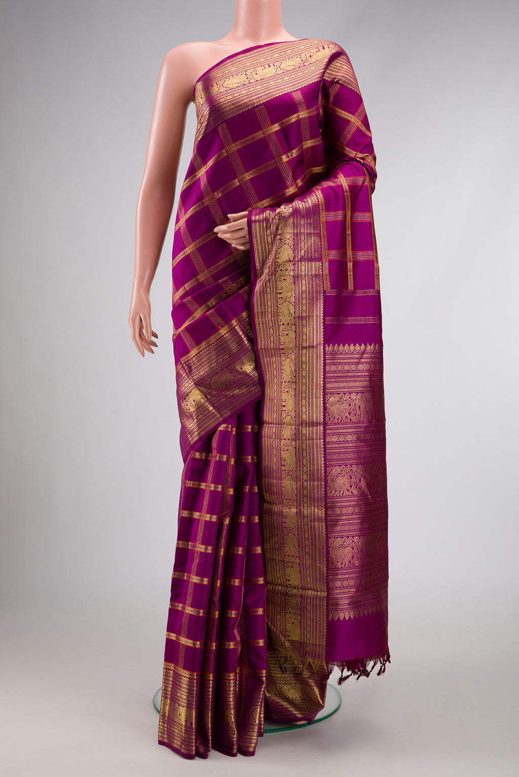 Pure Silk Pure Zari Magenta Dual Tone Kanchipuram Saree with Checked design on the body and Zari Border.  displayed on a mannequin