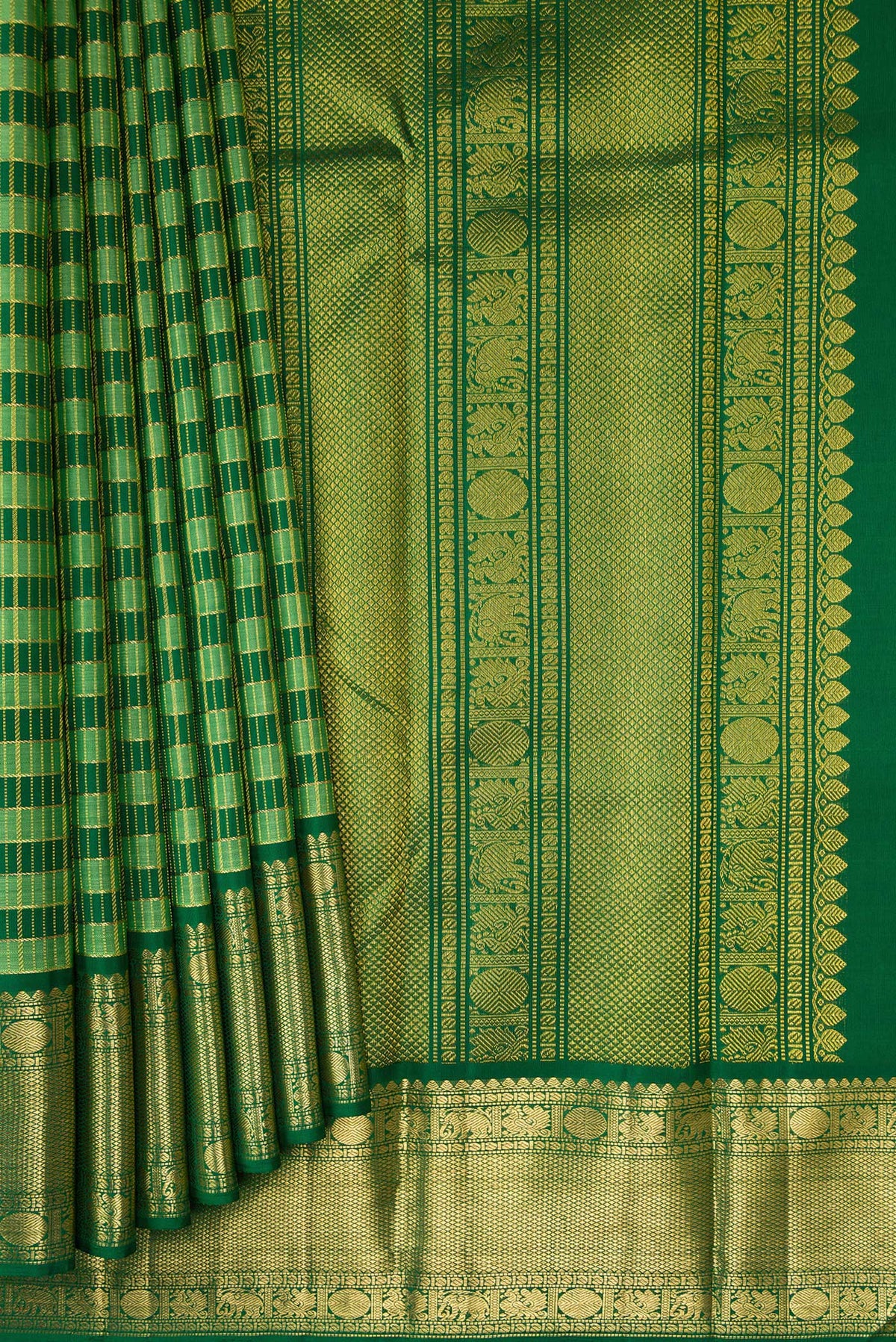 Pleats and pallu of Green Kanchipuram Silk Saree with Stripes on the body and Zari Border. 