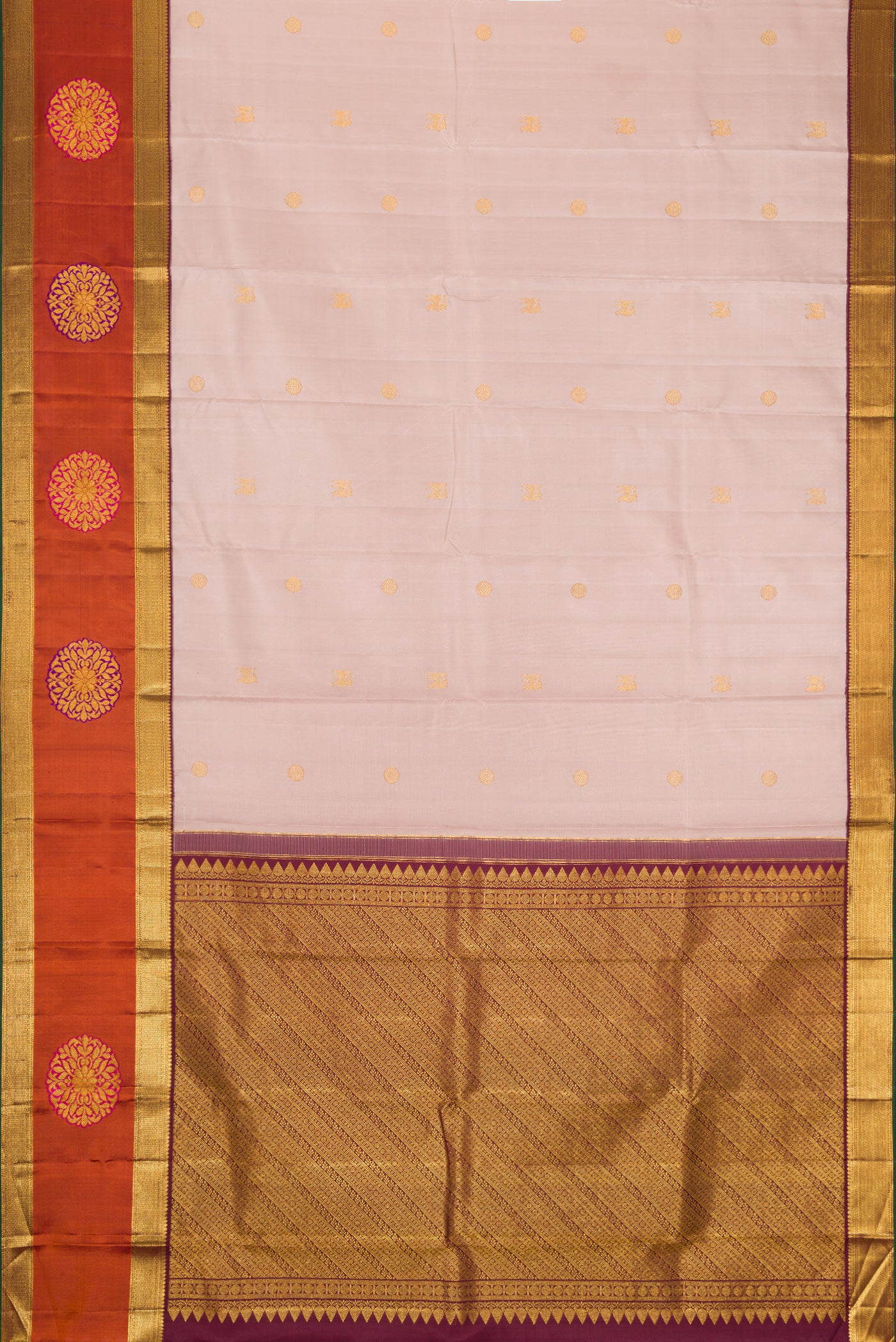 Flat view of Rose Gold Dual Tone Kanjivaram Silk Saree with Zari Butta on the body and Fancy Border. 