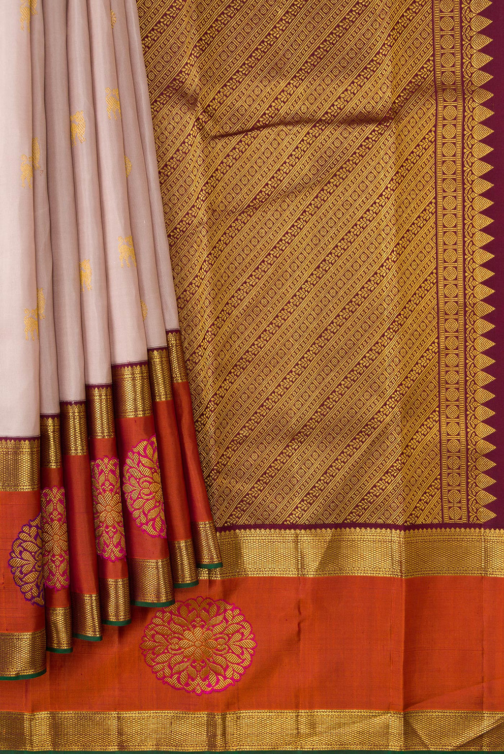 Pleats and pallu of Rose Gold Dual Tone Kanjivaram Silk Saree with Zari Butta on the body and Fancy Border. 