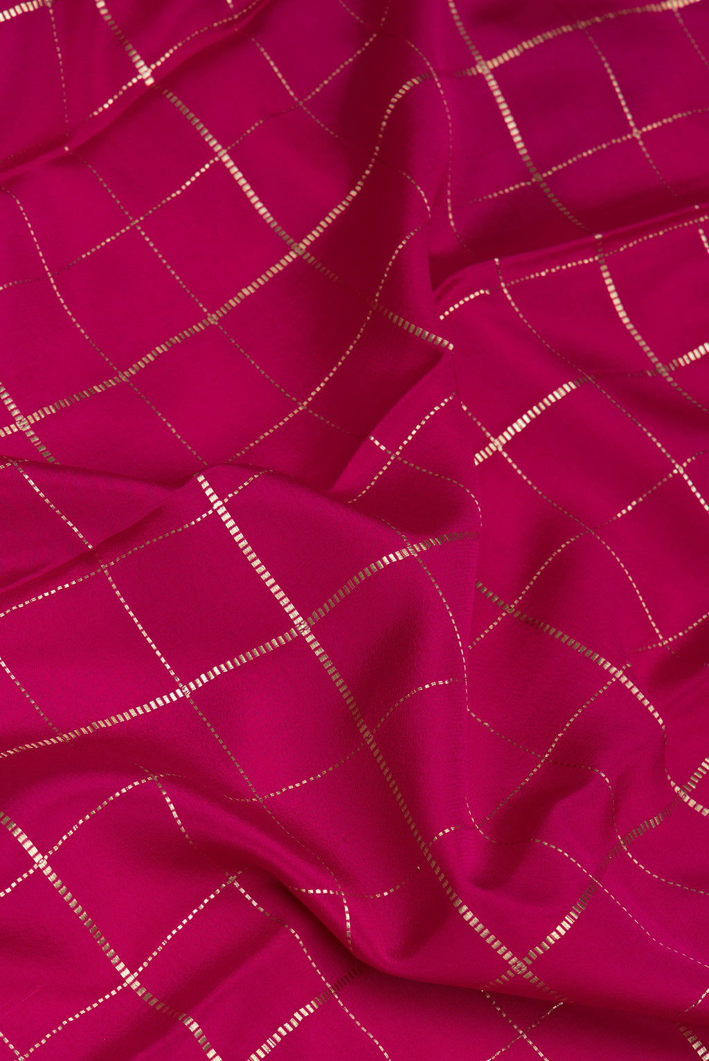 Close up of Dark Pink Mysore Silk Saree with Checked design on the body and Zari Border.  displaying folds