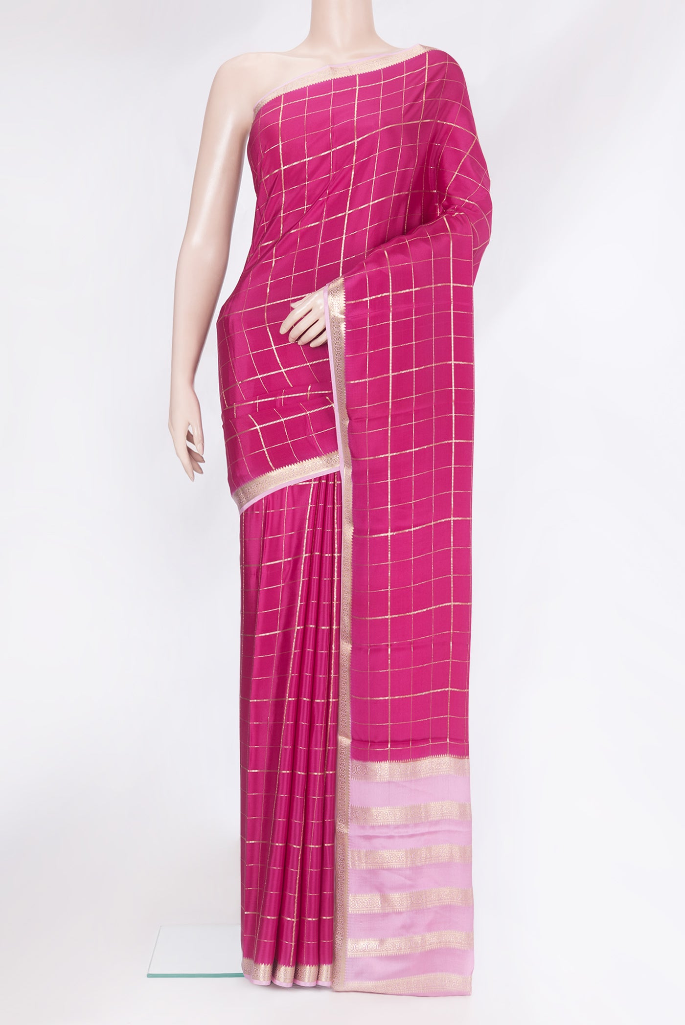 Dark Pink Mysore Silk Saree with Checked design on the body and Zari Border.  displayed on a mannequin