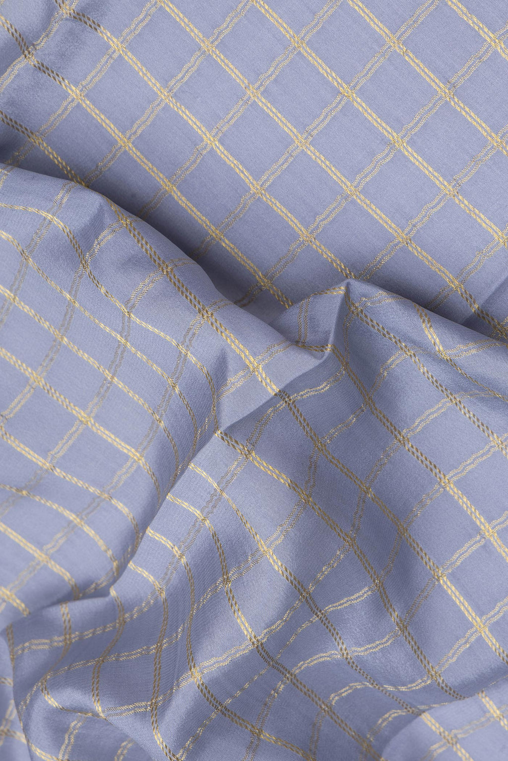 Close up of Grey Dual Tone Mysore Silk Saree with Checked design on the body and Zari Border.  displaying folds