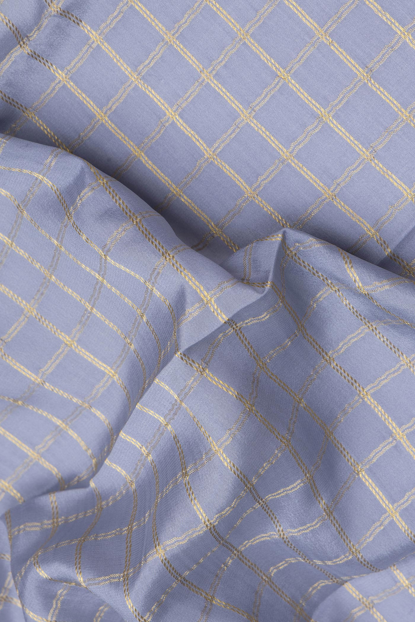 Close up of Grey Dual Tone Mysore Silk Saree with Checked design on the body and Zari Border.  displaying folds