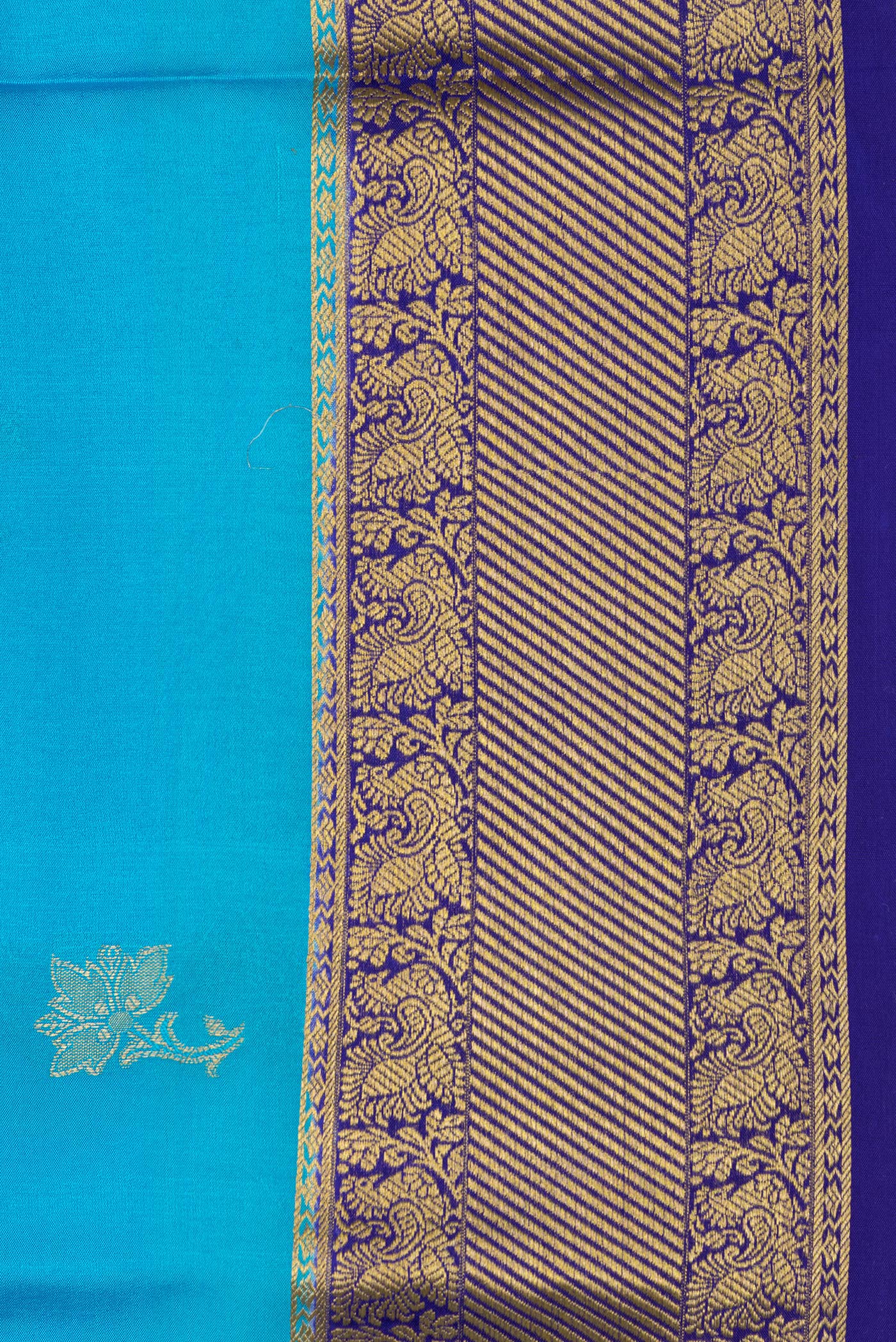 Border image of Sky Blue Dual Tone Mysore Silk Saree with Zari Butta on the body and Zari Border. 