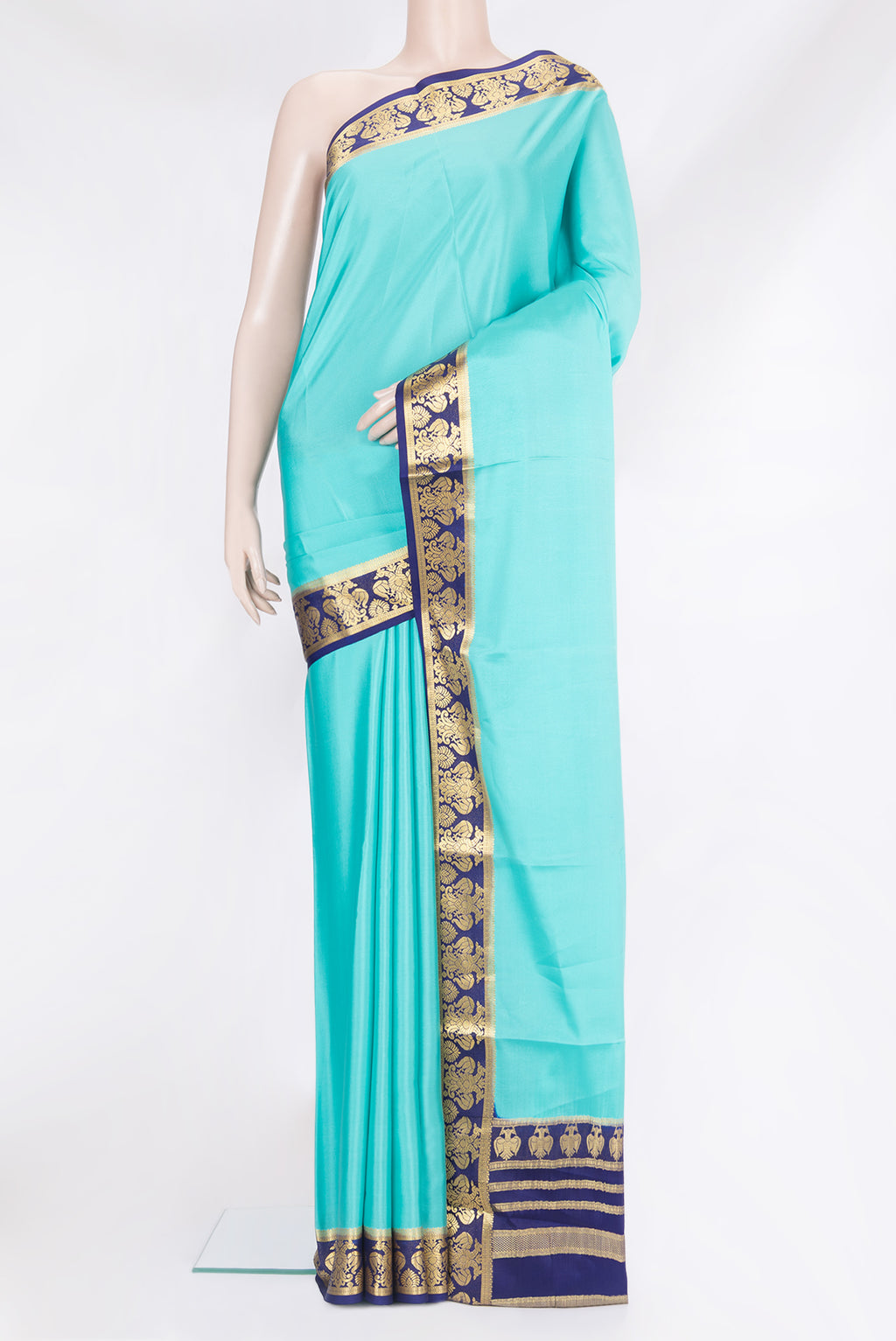 Sky Blue Mysore Silk Saree with Plain Body and Zari Border.  displayed on a mannequin