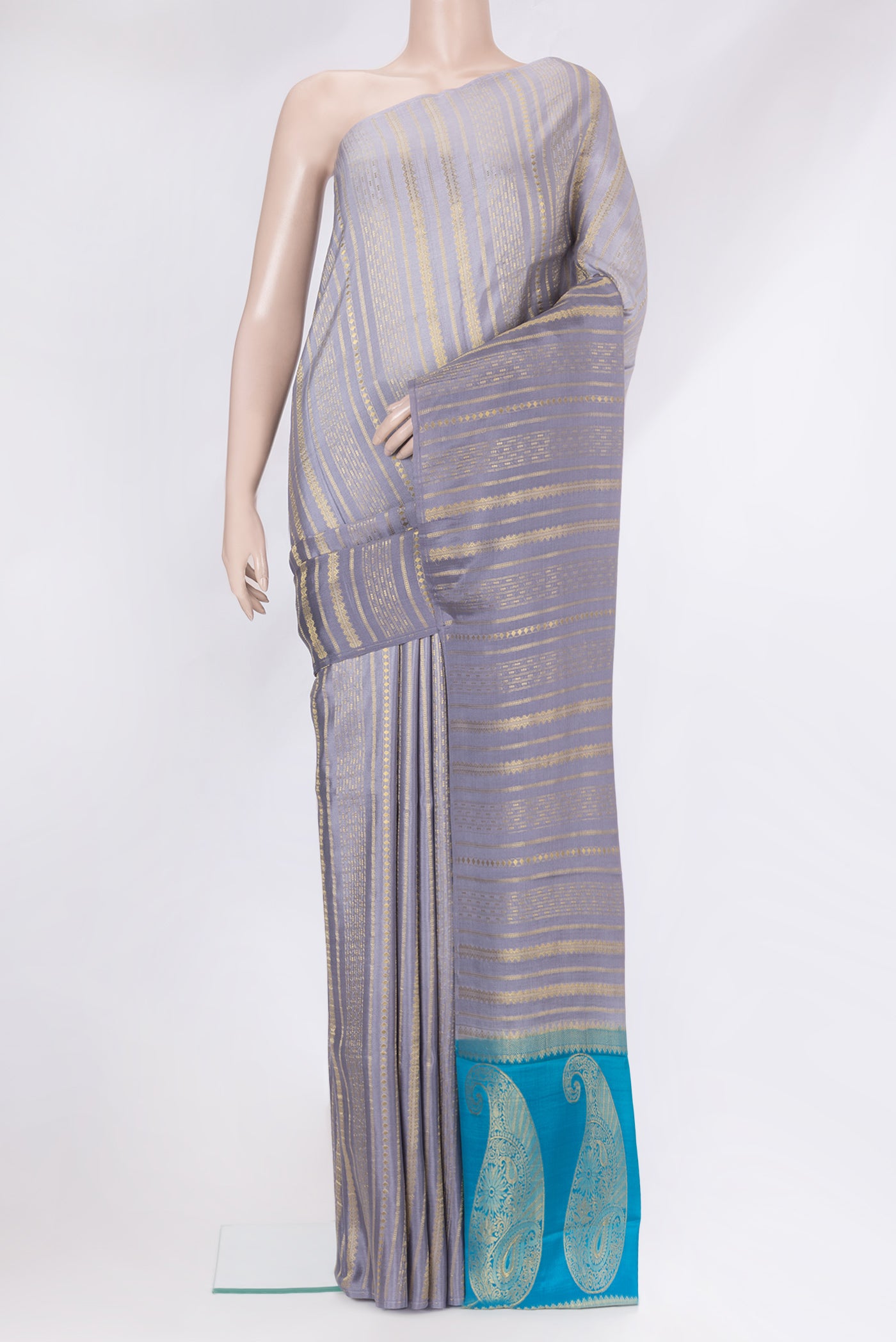 Grey Mysore Silk Saree with Stripes on the body and Without Border.  displayed on a mannequin