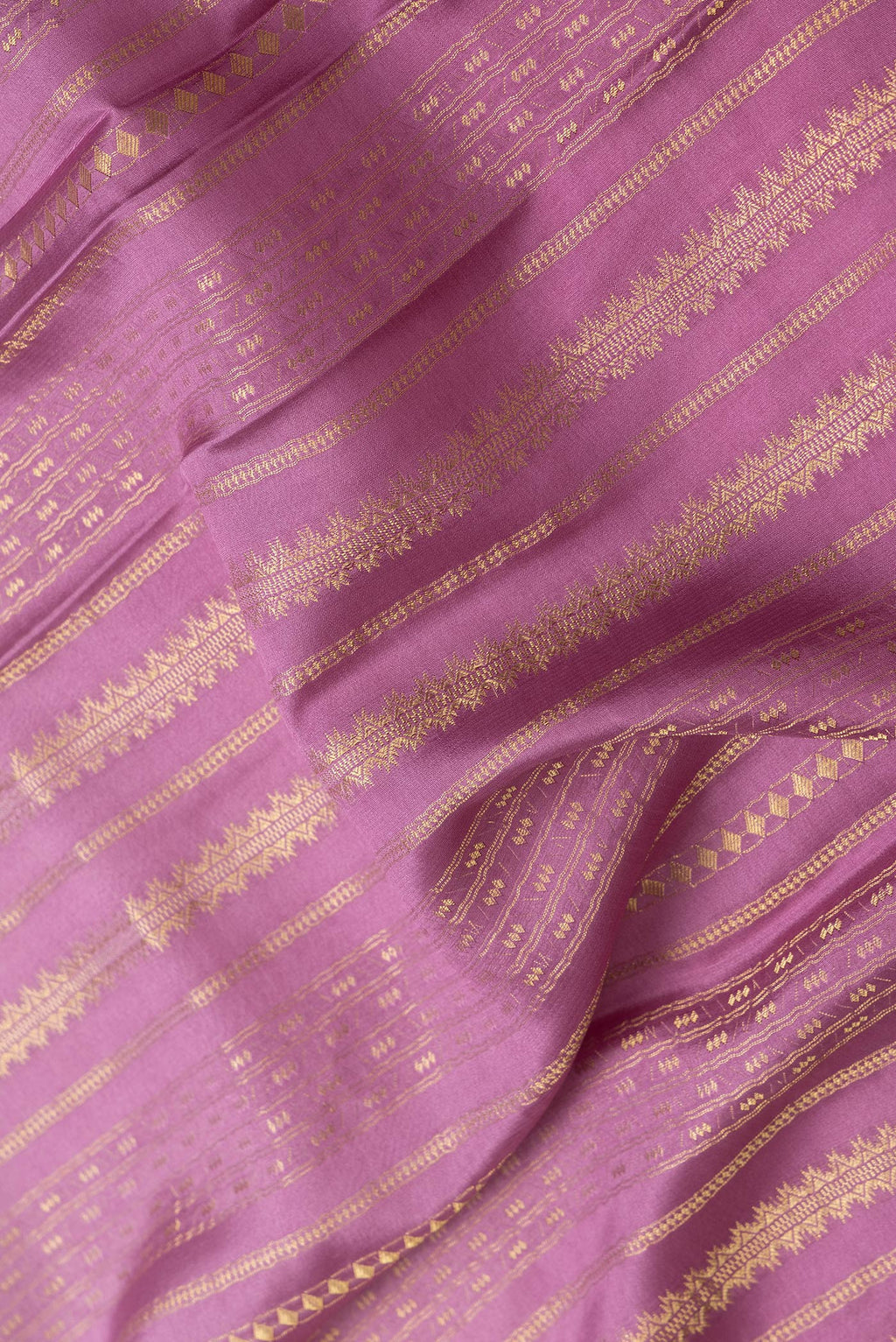Close up of Pink Dual Tone Mysore Silk Saree with Stripes on the body and Without Border.  displaying folds
