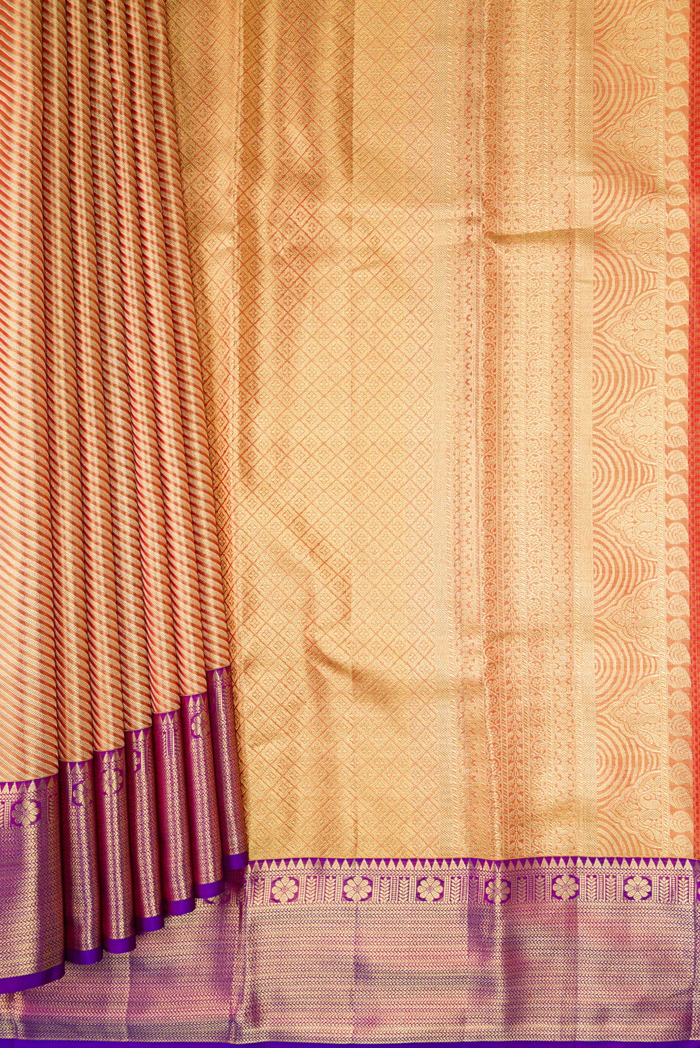 Pleats and pallu of Golden Peach Dual Tone Kanchipuram Tissue Silk Saree with Zari Brocade on the body and Zari Border. 