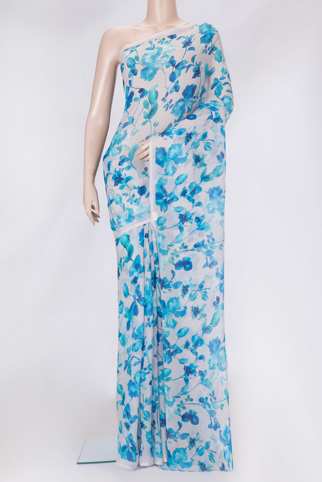 Off White Dual Tone Crepe Saree with Printed design on the body and Without Border.  displayed on a mannequin