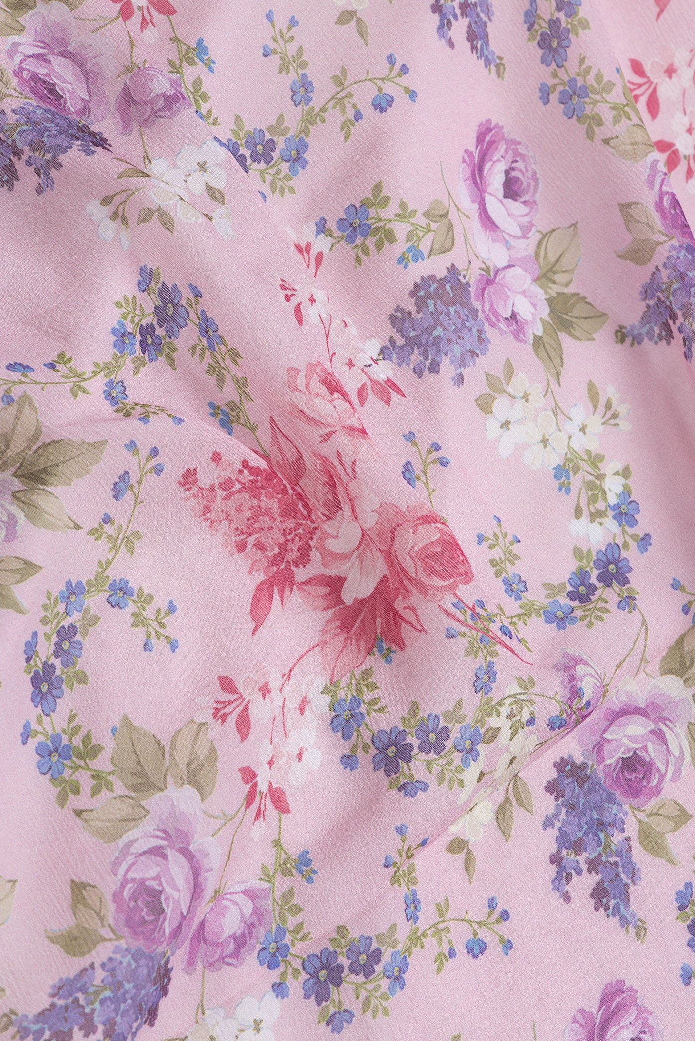 Close up of Pink Dual Tone Mysore Chiffon Saree with Printed design on the body and Without Border.  displaying folds