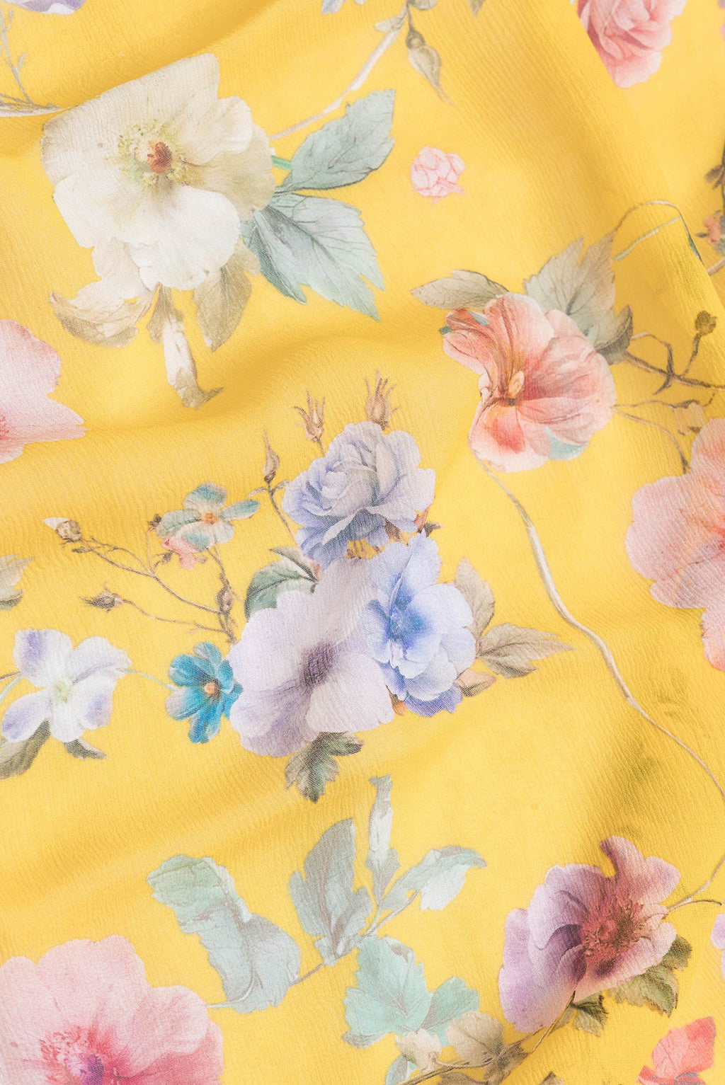 Close up of Yellow Dual Tone Mysore Chiffon Saree with Printed design on the body and Without Border.  displaying folds