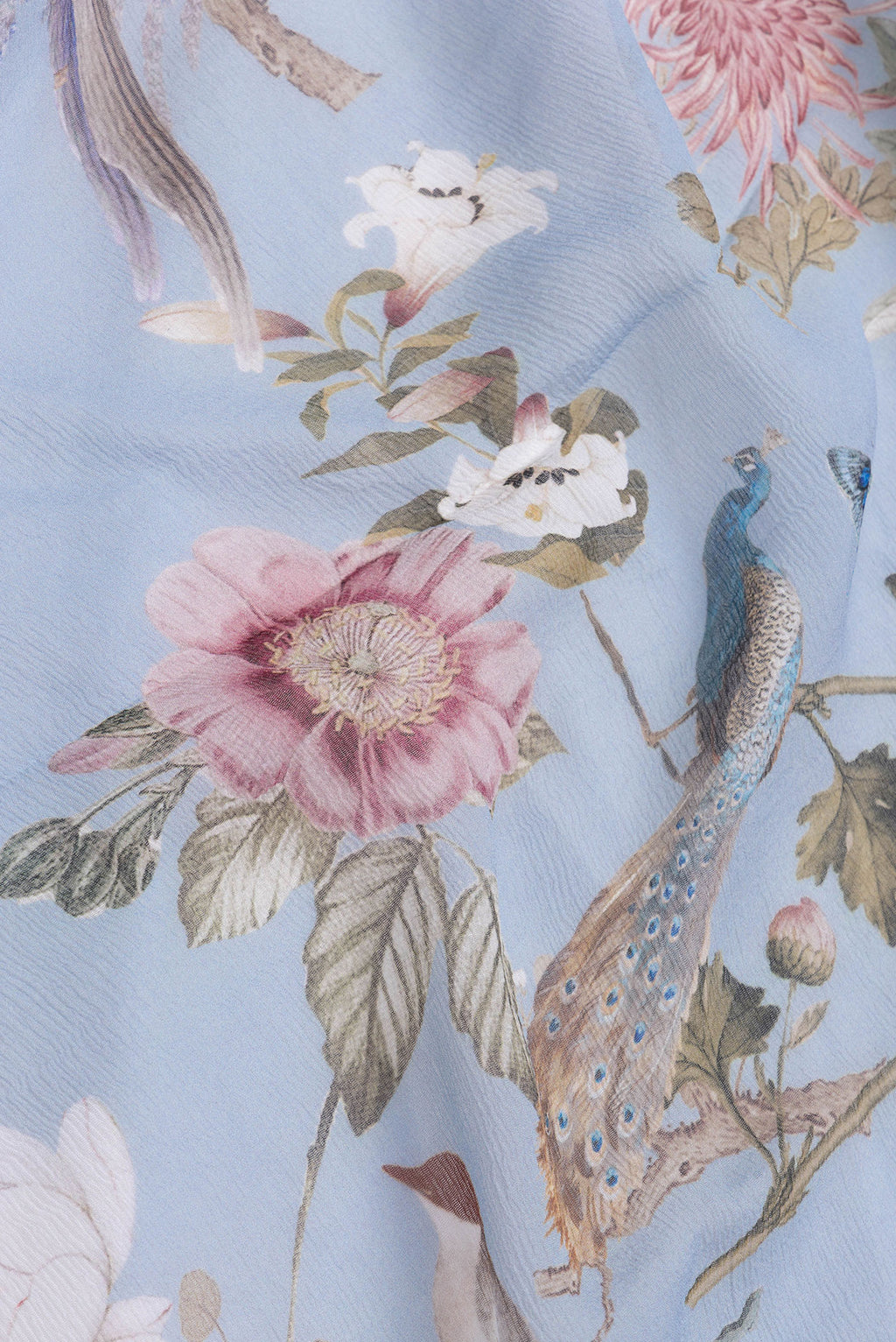 Close up of Light Blue Dual Tone Mysore Chiffon Saree with Printed design on the body and Without Border.  displaying folds