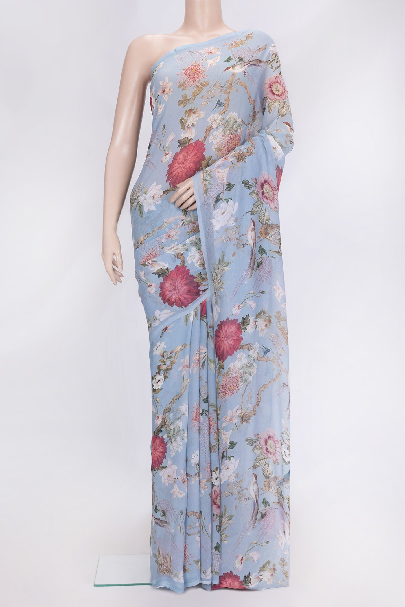 Light Blue Dual Tone Mysore Chiffon Saree with Printed design on the body and Without Border.  displayed on a mannequin