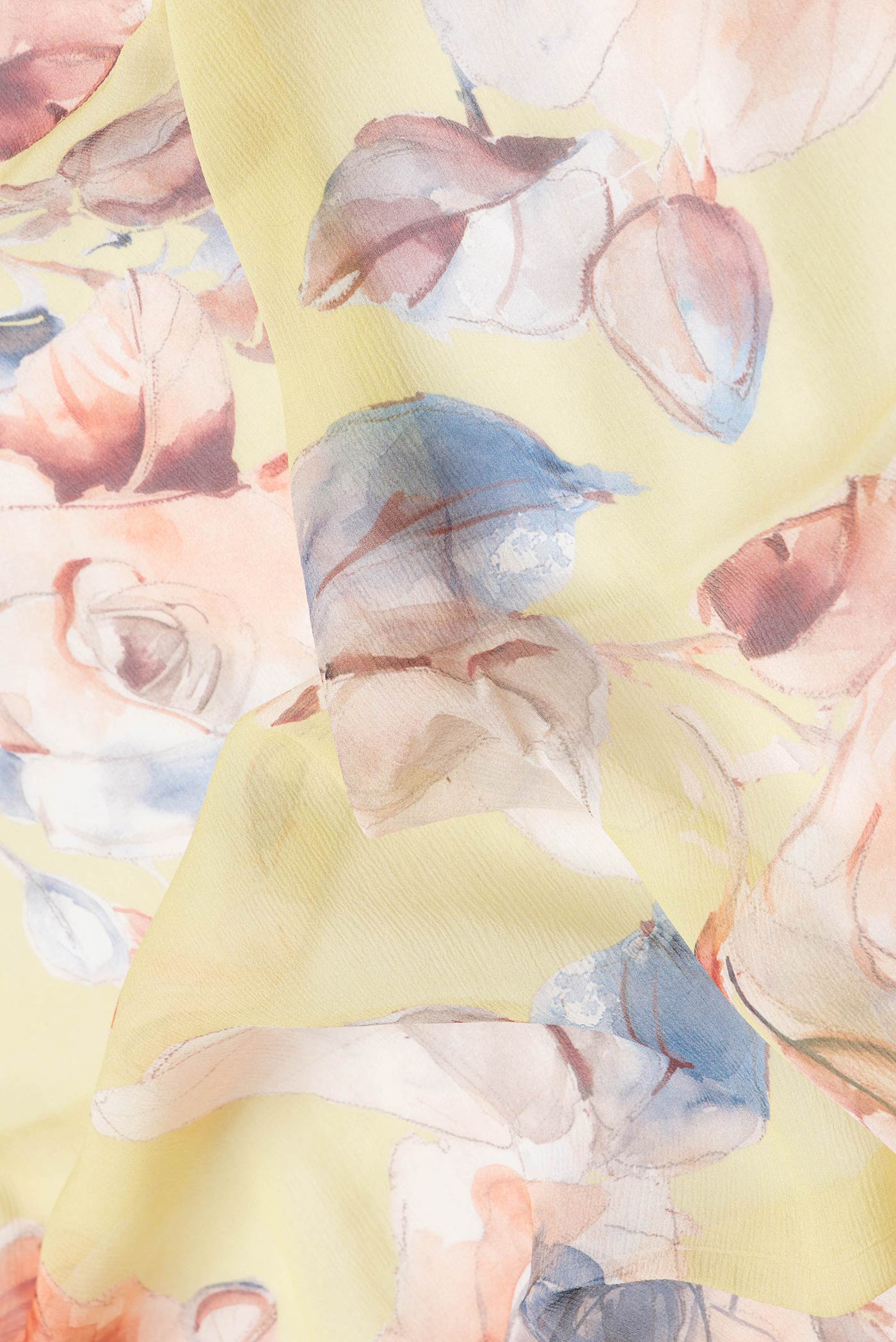 Close up of Lemon Yellow Dual Tone Mysore Chiffon Saree with Printed design on the body and Without Border.  displaying folds