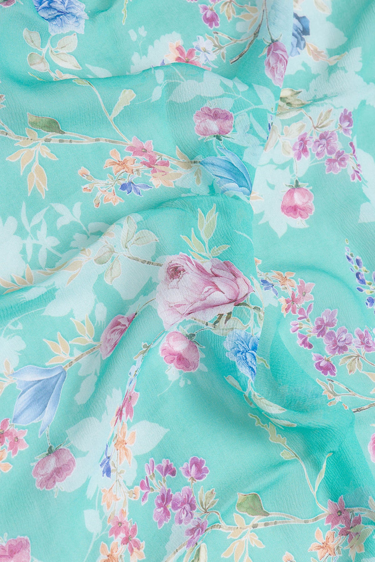 Close up of Sea Green Dual Tone Mysore Chiffon Saree with Printed design on the body and Without Border.  displaying folds