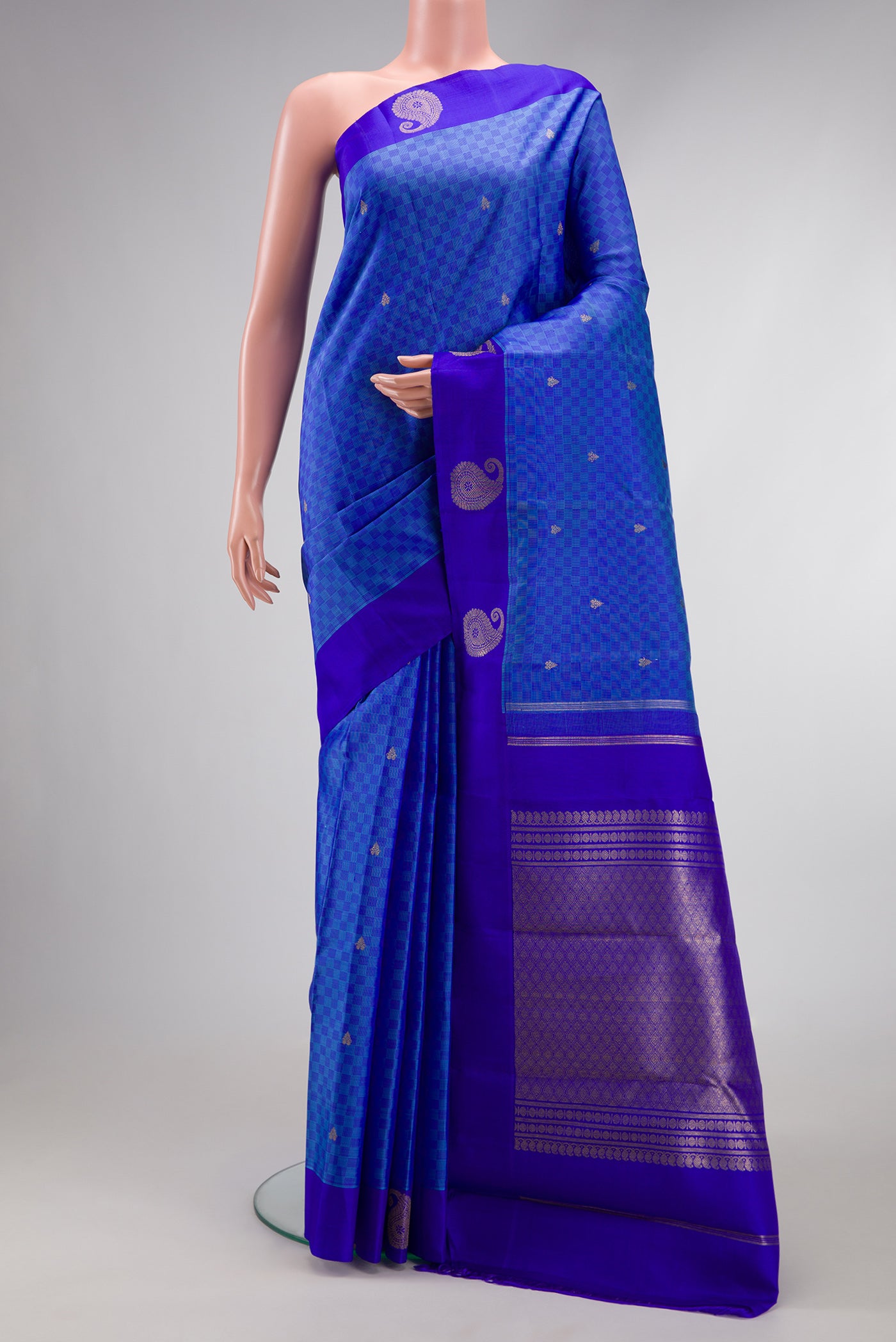 Pure Silk Pure Zari Light Blue Dual Tone Kanchipuram Saree with Zari Butta on the body and Fancy Border.  displayed on a mannequin
