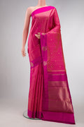 Pure Silk Pure Zari Peach Dual Tone Kanchipuram Saree with Zari Butta on the body and Fancy Border.  displayed on a mannequin