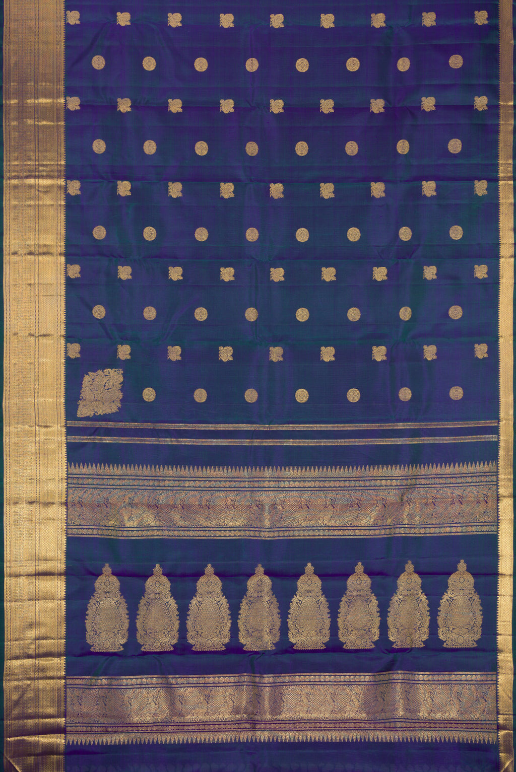 Flat view of Pure Silk Pure Zari Peacock Blue Dual Tone Kanjivaram Saree with Zari Butta on the body and Zari Border. 