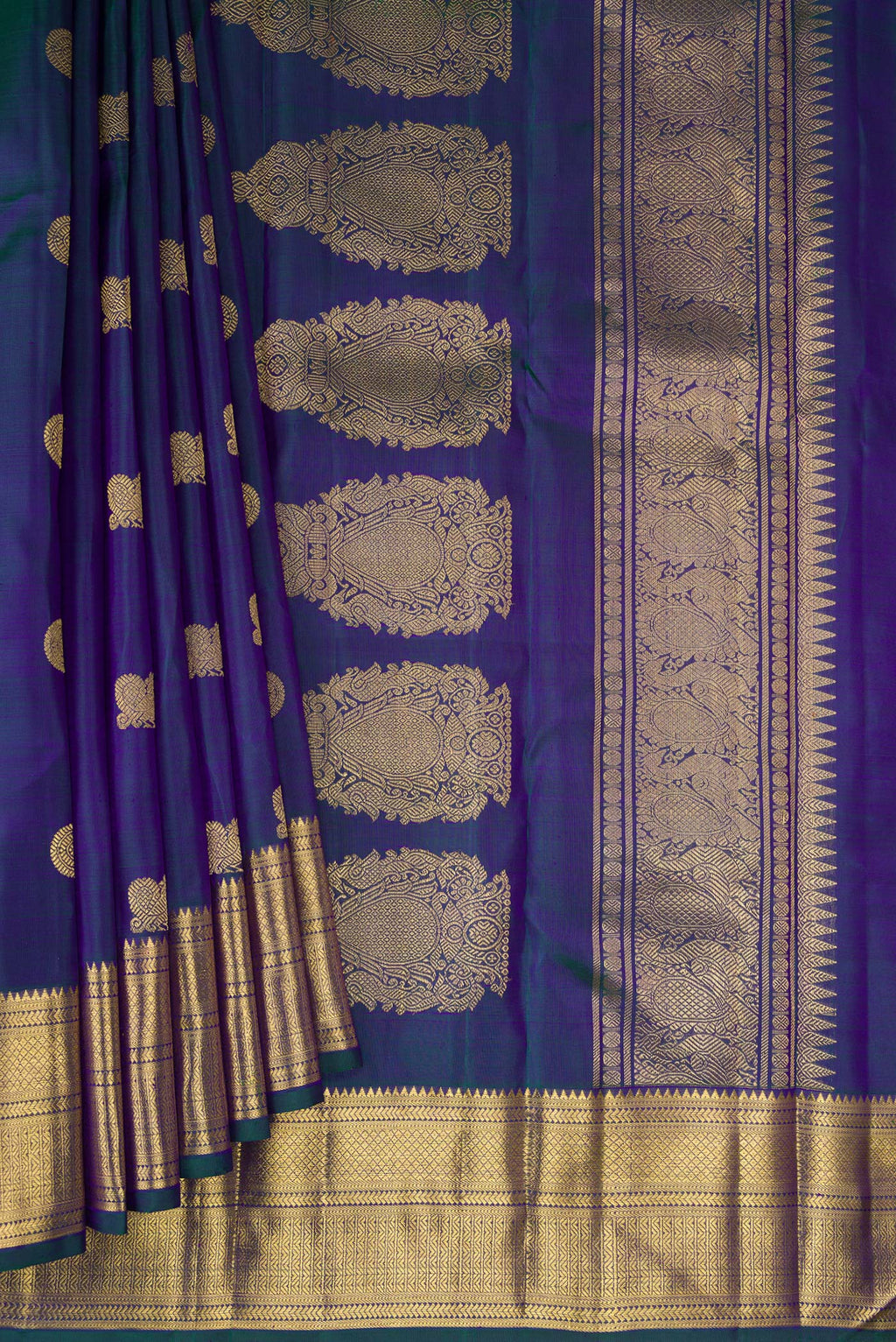 Pleats and pallu of Pure Silk Pure Zari Peacock Blue Dual Tone Kanjivaram Saree with Zari Butta on the body and Zari Border. 