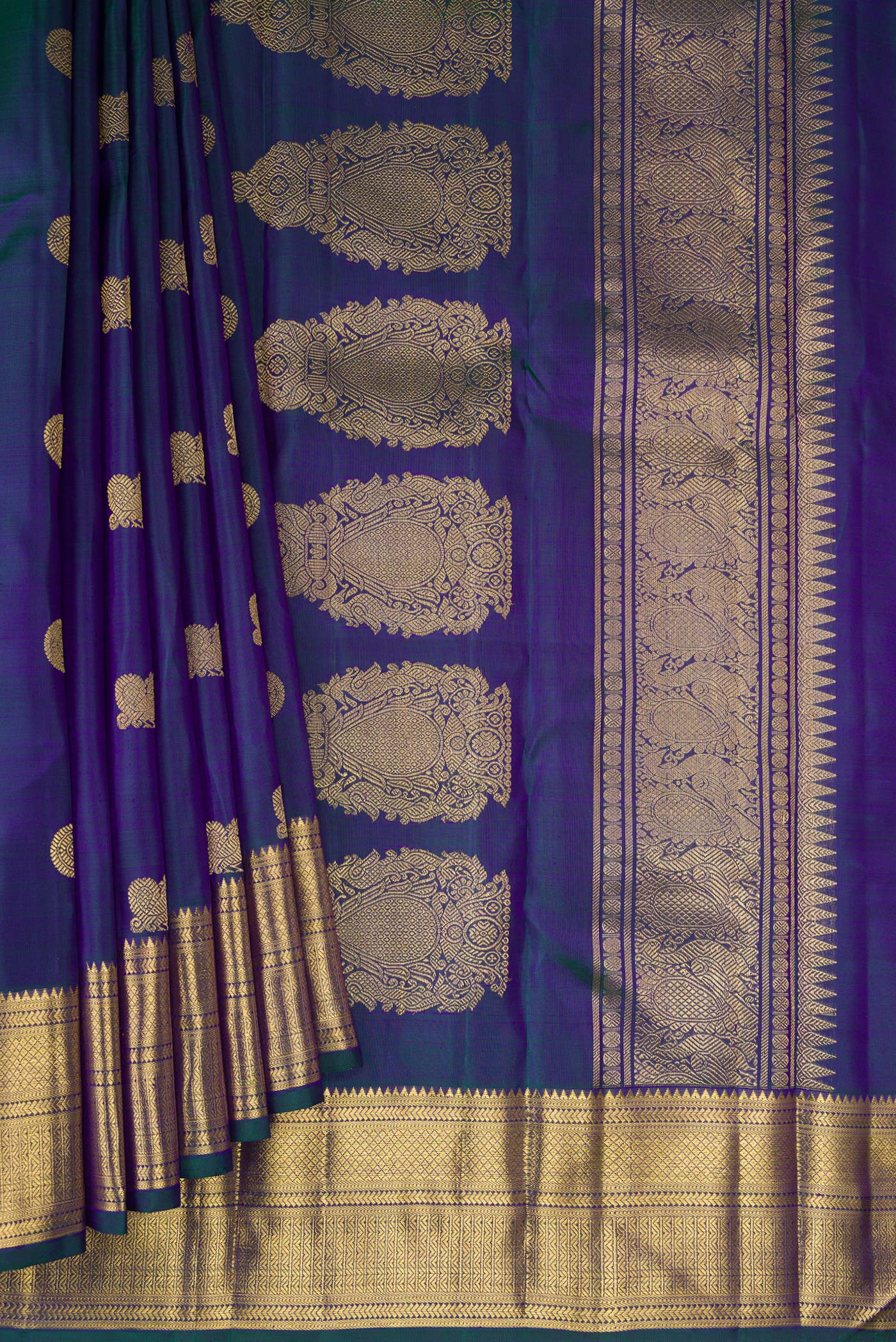 Pleats and pallu of Pure Silk Pure Zari Peacock Blue Dual Tone Kanjivaram Saree with Zari Butta on the body and Zari Border. 