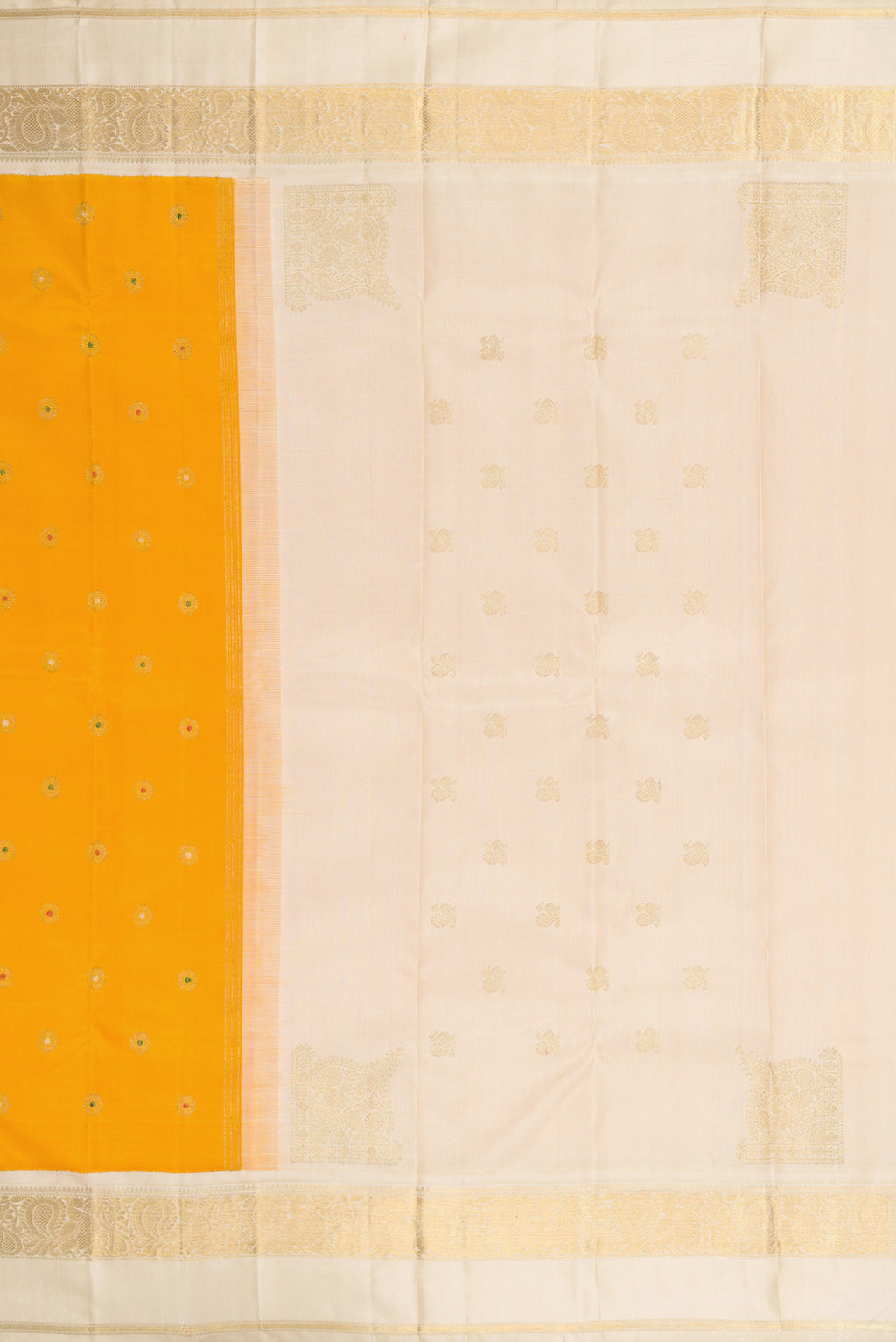 Close up image of the pallu of Pure Silk Pure Zari Mustard Dual Tone Kanjivaram Saree with Zari And Thread Butta on the body and Zari Border. 