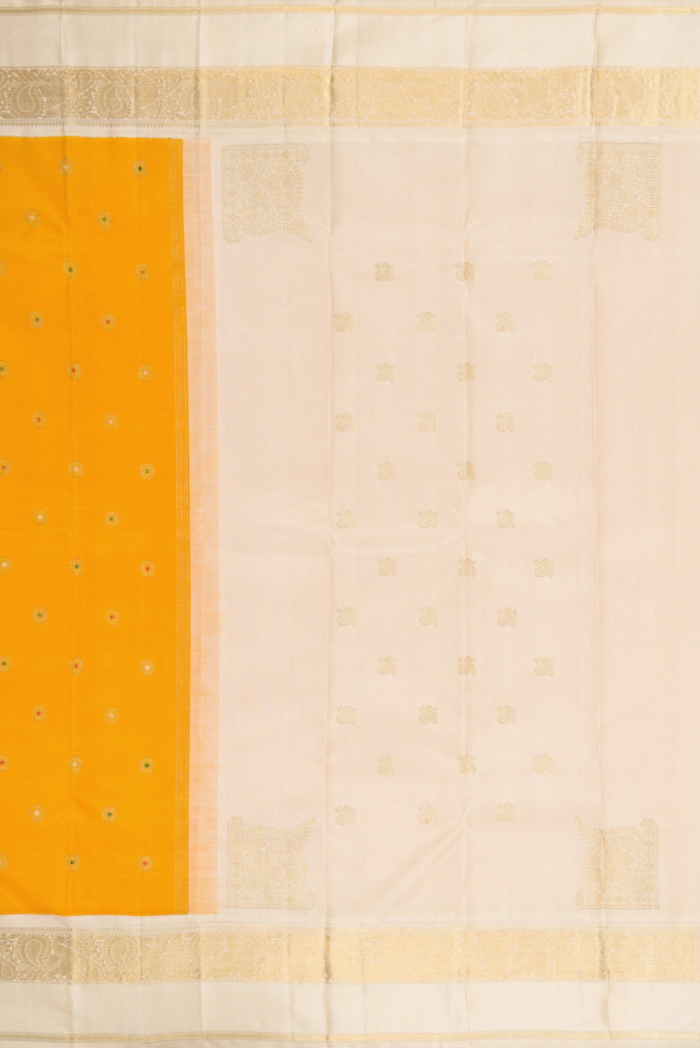 Close up image of the pallu of Pure Silk Pure Zari Mustard Dual Tone Kanjivaram Saree with Zari And Thread Butta on the body and Zari Border. 
