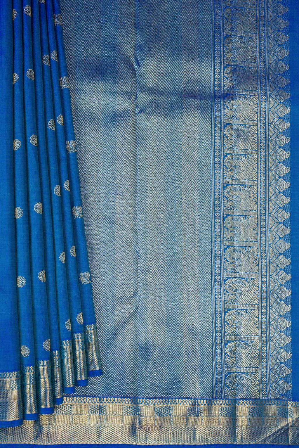 Pleats and pallu of Pure Silk Pure Zari Peacock Blue Dual Tone Kanjivaram Saree with Zari Butta on the body and Zari Border. 