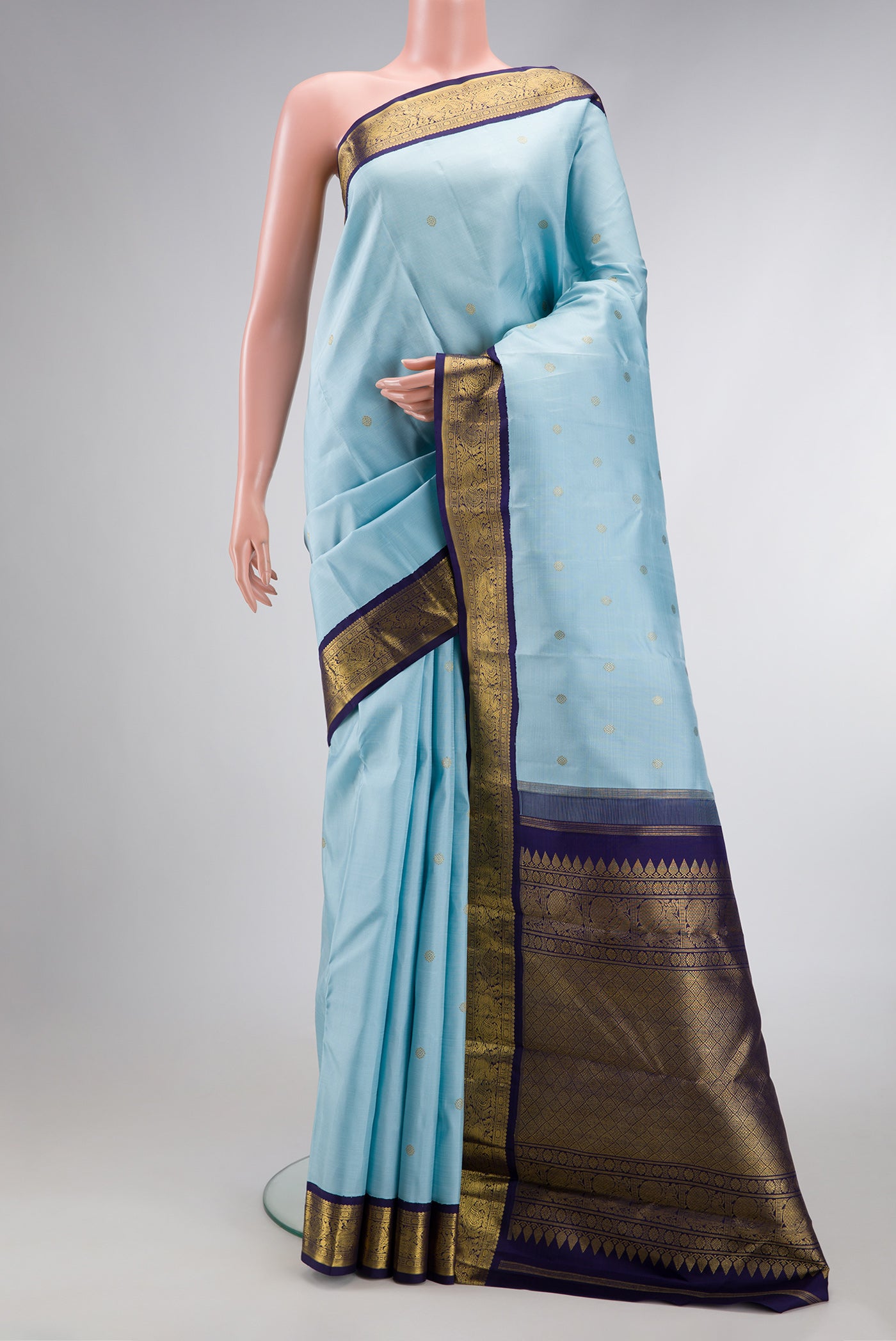 Pure Silk Pure Zari Sky Blue Dual Tone Kanjivaram Saree with Zari Butta on the body and Zari Border.  displayed on a mannequin