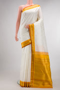 Pure Silk Pure Zari Off White Kanjivaram Saree with Zari Butta on the body and Zari Border.  displayed on a mannequin