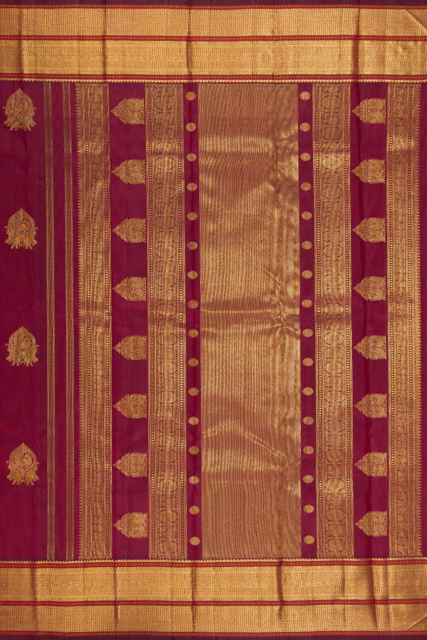 Close up image of the pallu of Pure Silk Pure Zari Maroon Kanjivaram Saree with Zari Butta on the body and Zari Border. 