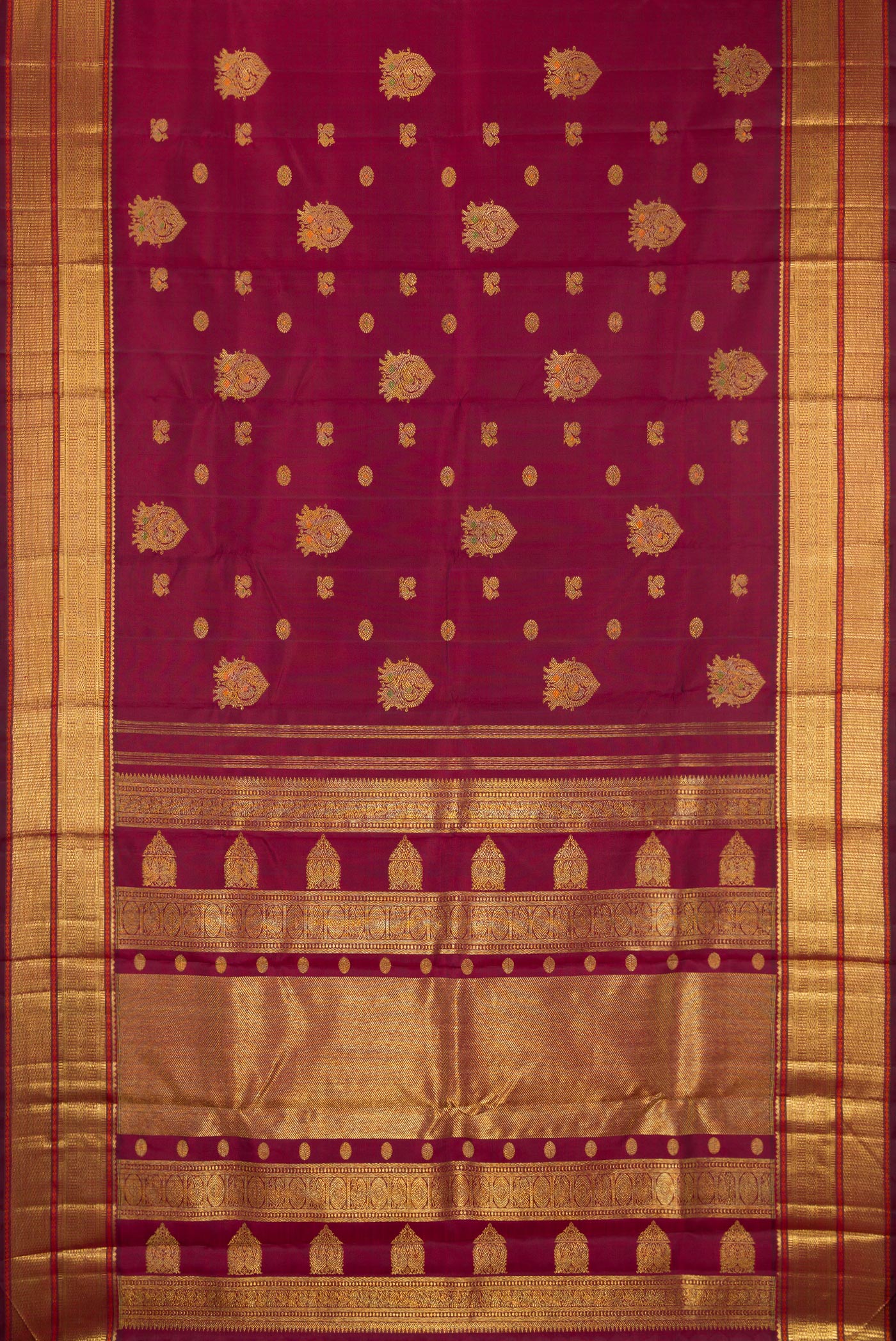 Flat view of Pure Silk Pure Zari Maroon Kanjivaram Saree with Zari Butta on the body and Zari Border. 