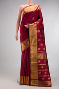 Pure Silk Pure Zari Maroon Kanjivaram Saree with Zari Butta on the body and Zari Border.  displayed on a mannequin