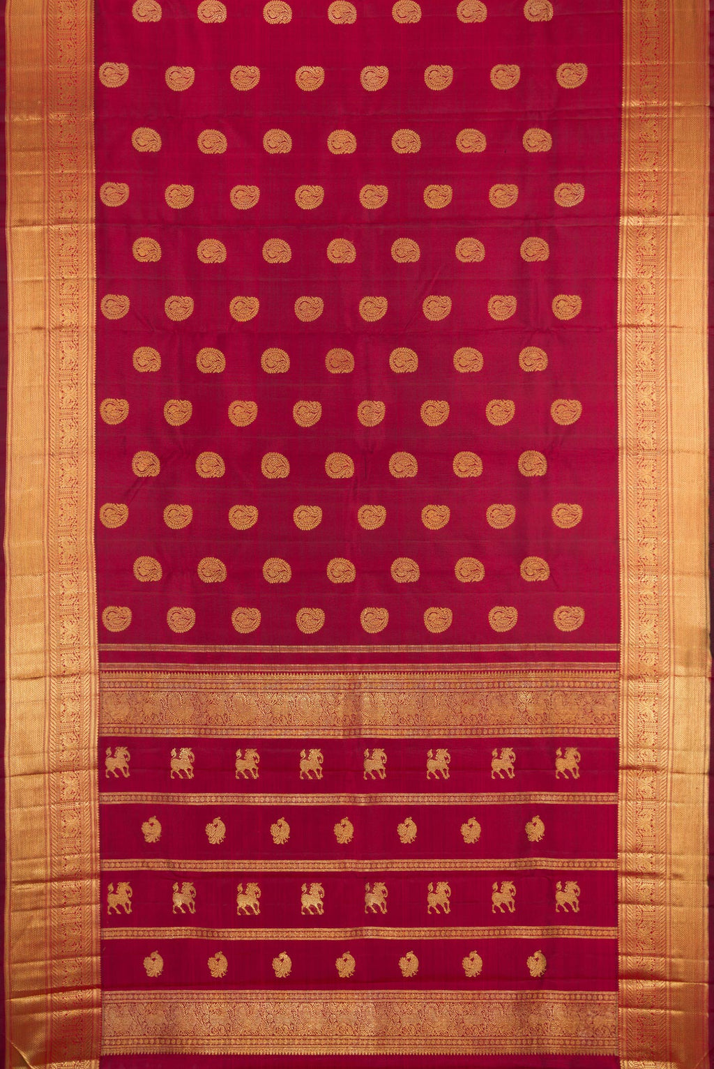 Flat view of Pure Silk Pure Zari Maroon Kanjivaram Saree with Zari Butta on the body and Zari Border. 