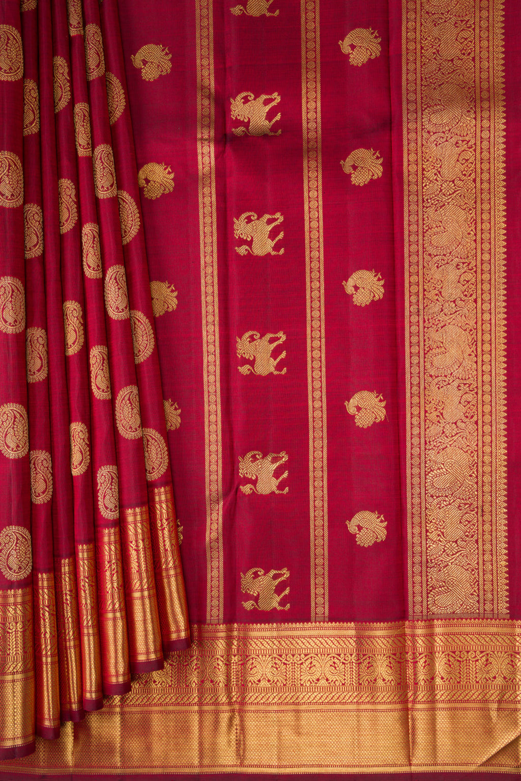 Pleats and pallu of Pure Silk Pure Zari Maroon Kanjivaram Saree with Zari Butta on the body and Zari Border. 
