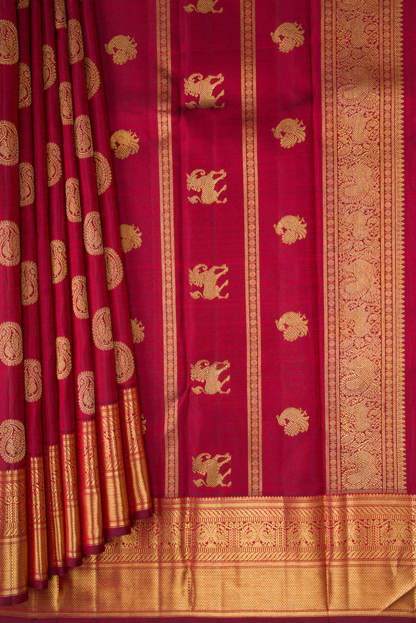 Pleats and pallu of Pure Silk Pure Zari Maroon Kanjivaram Saree with Zari Butta on the body and Zari Border. 