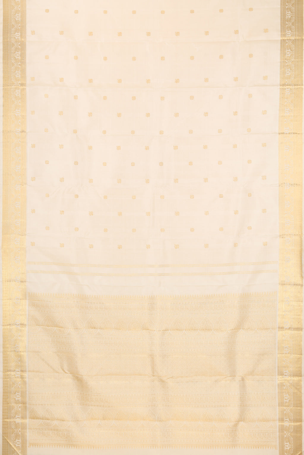 Flat view of Pure Silk Pure Zari Cream Kanjivaram Saree with Zari Butta on the body and Fancy Border. 
