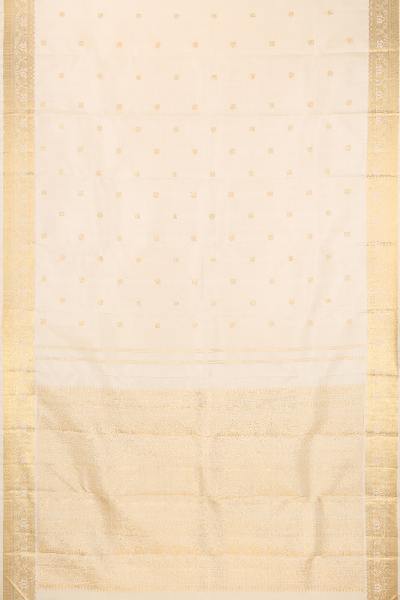 Flat view of Pure Silk Pure Zari Cream Kanjivaram Saree with Zari Butta on the body and Fancy Border. 