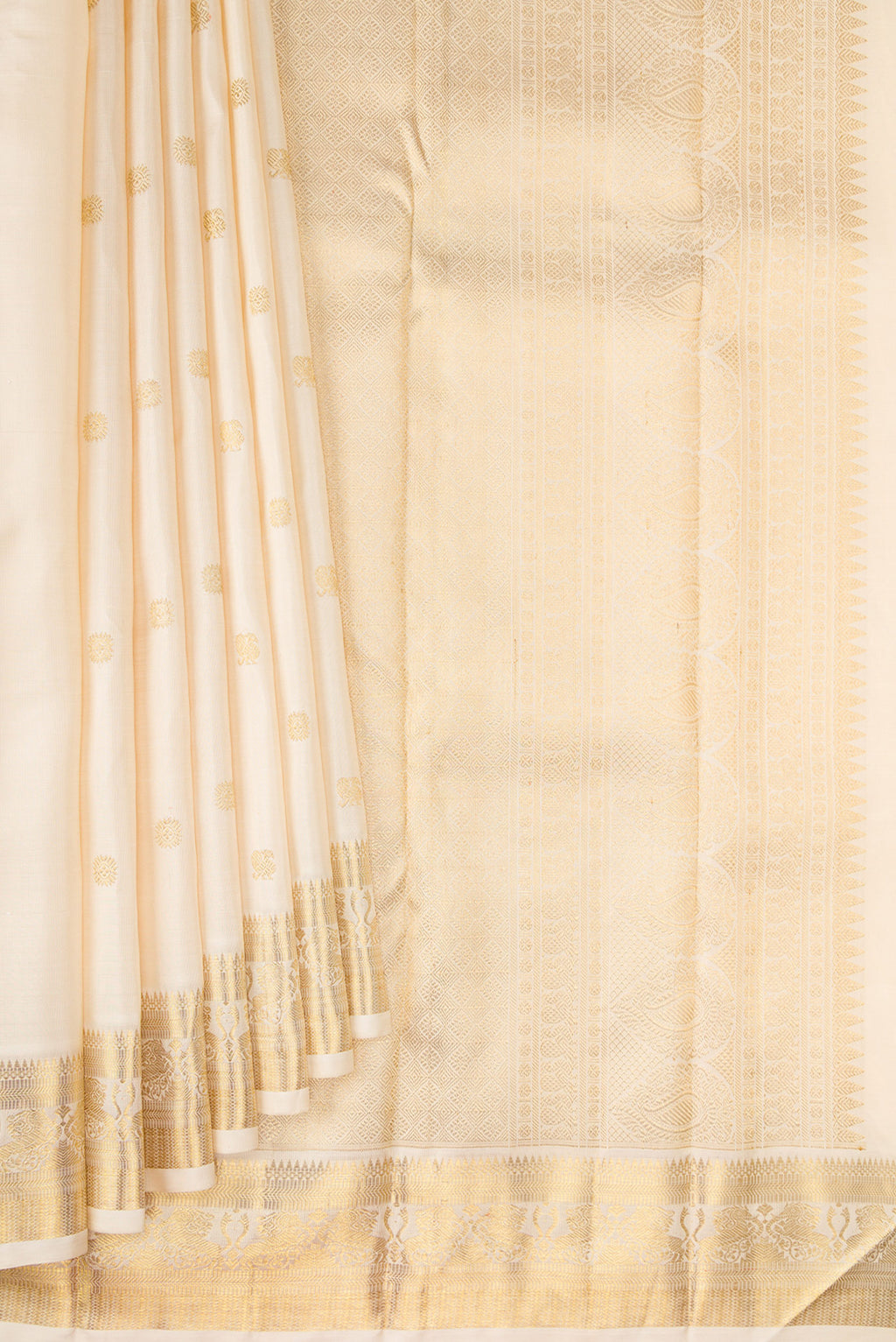 Pleats and pallu of Pure Silk Pure Zari Cream Kanjivaram Saree with Zari Butta on the body and Fancy Border. 